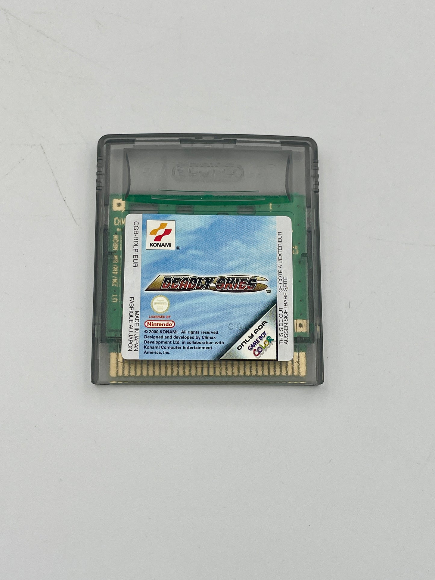 Game cartridge for a handheld gaming console on a white background