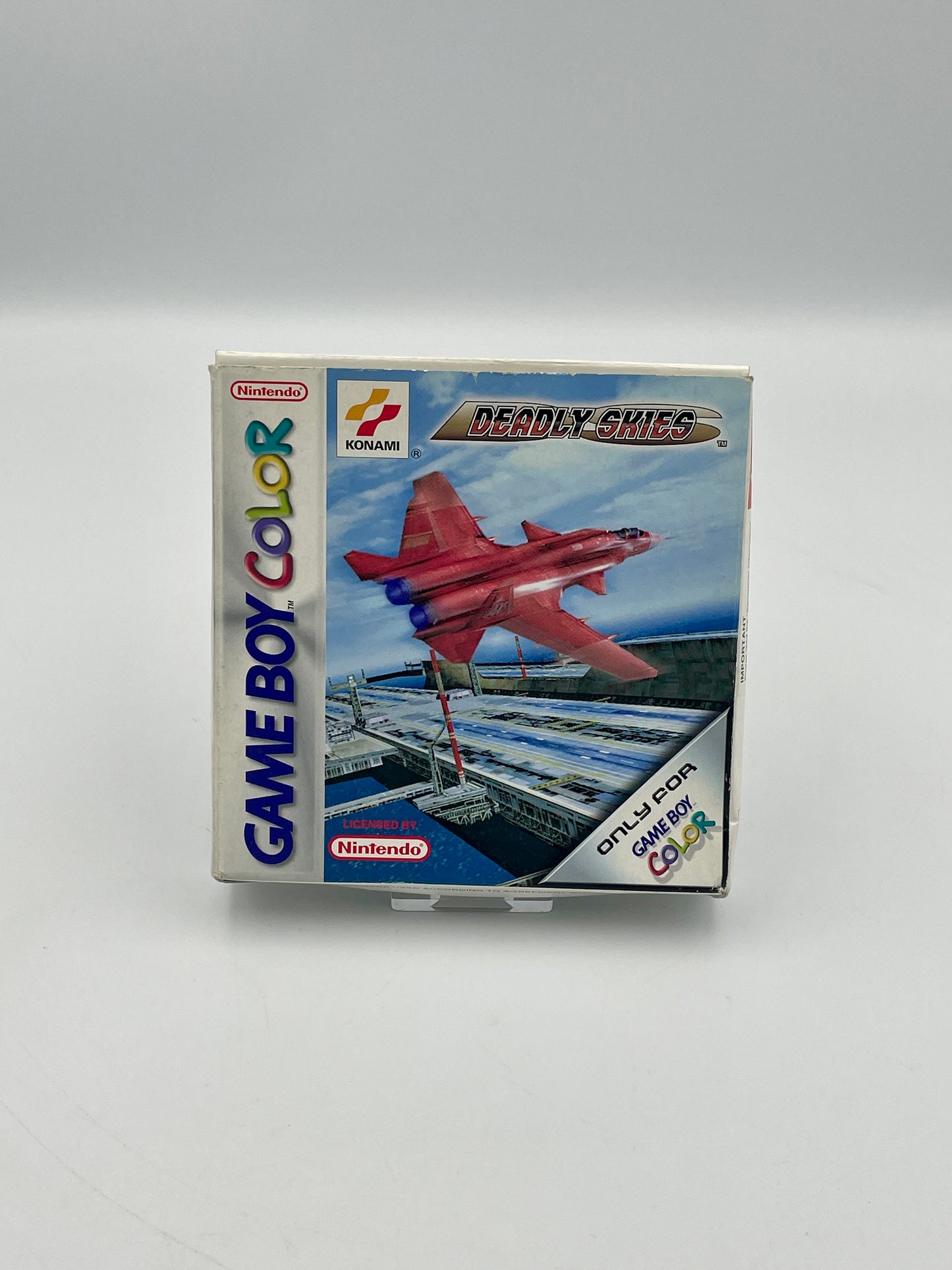 Game Boy Color game cartridge with airplane design on a white background