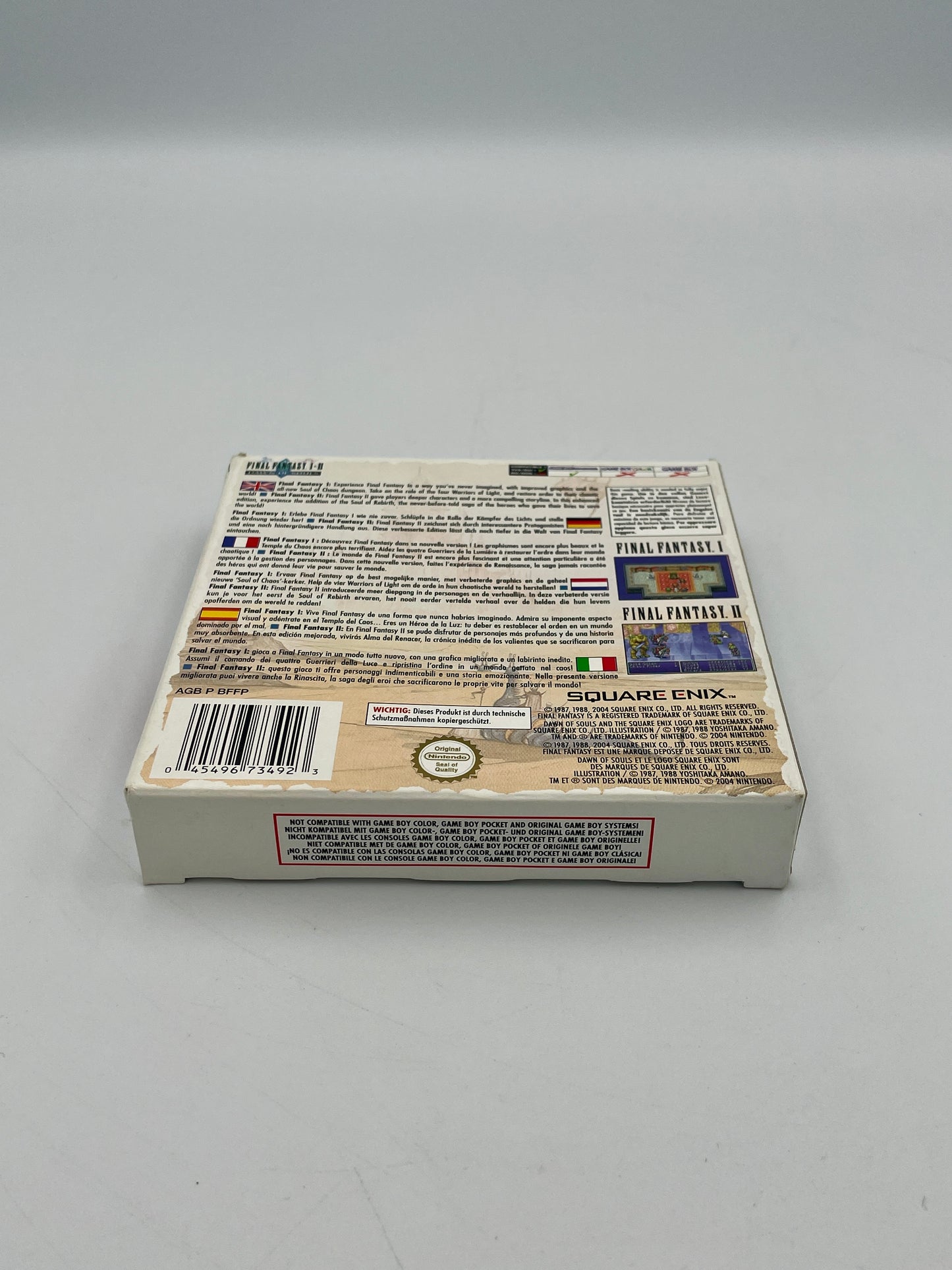 Back of a video game case with text and logos on a gray background