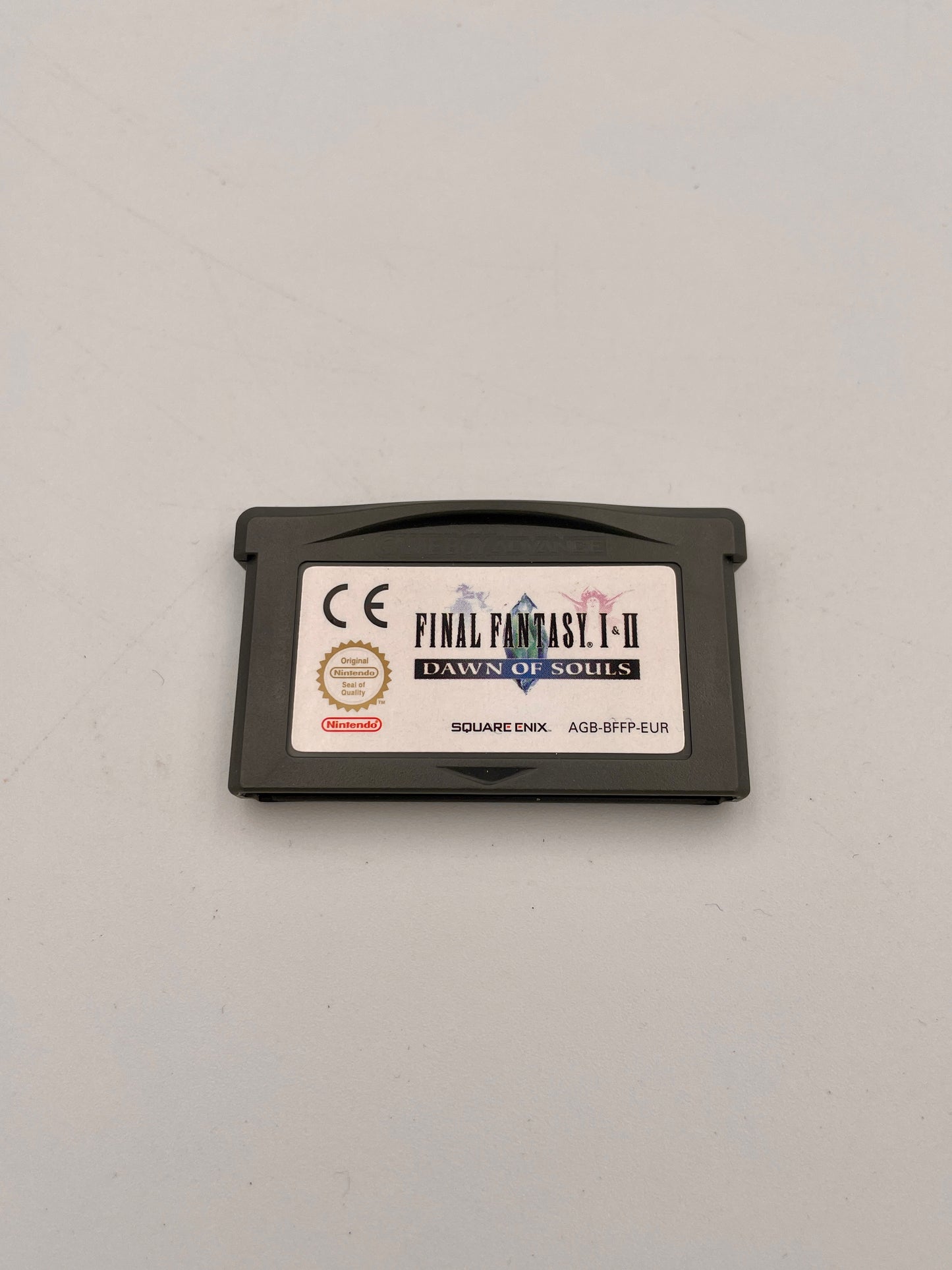 Game cartridge for 'Final Fantasy I-II' on a light gray background