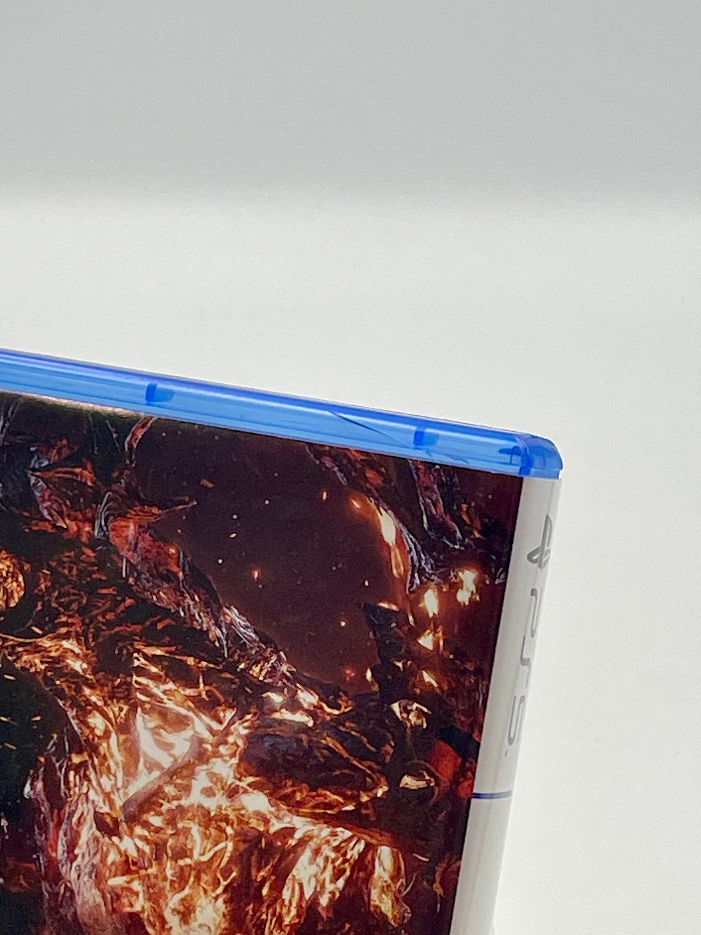 Close-up of a game case with a nature-themed design on a white background