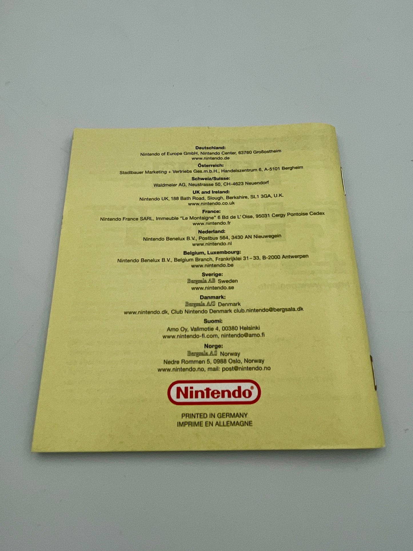 Nintendo document with text and logo on a yellow background