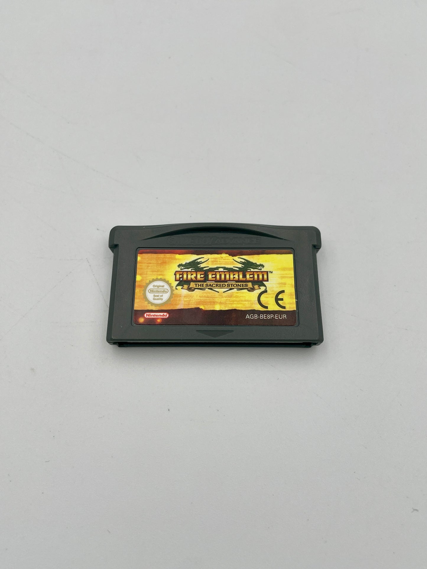 Game cartridge for 'Fire Emblem' on a gray background