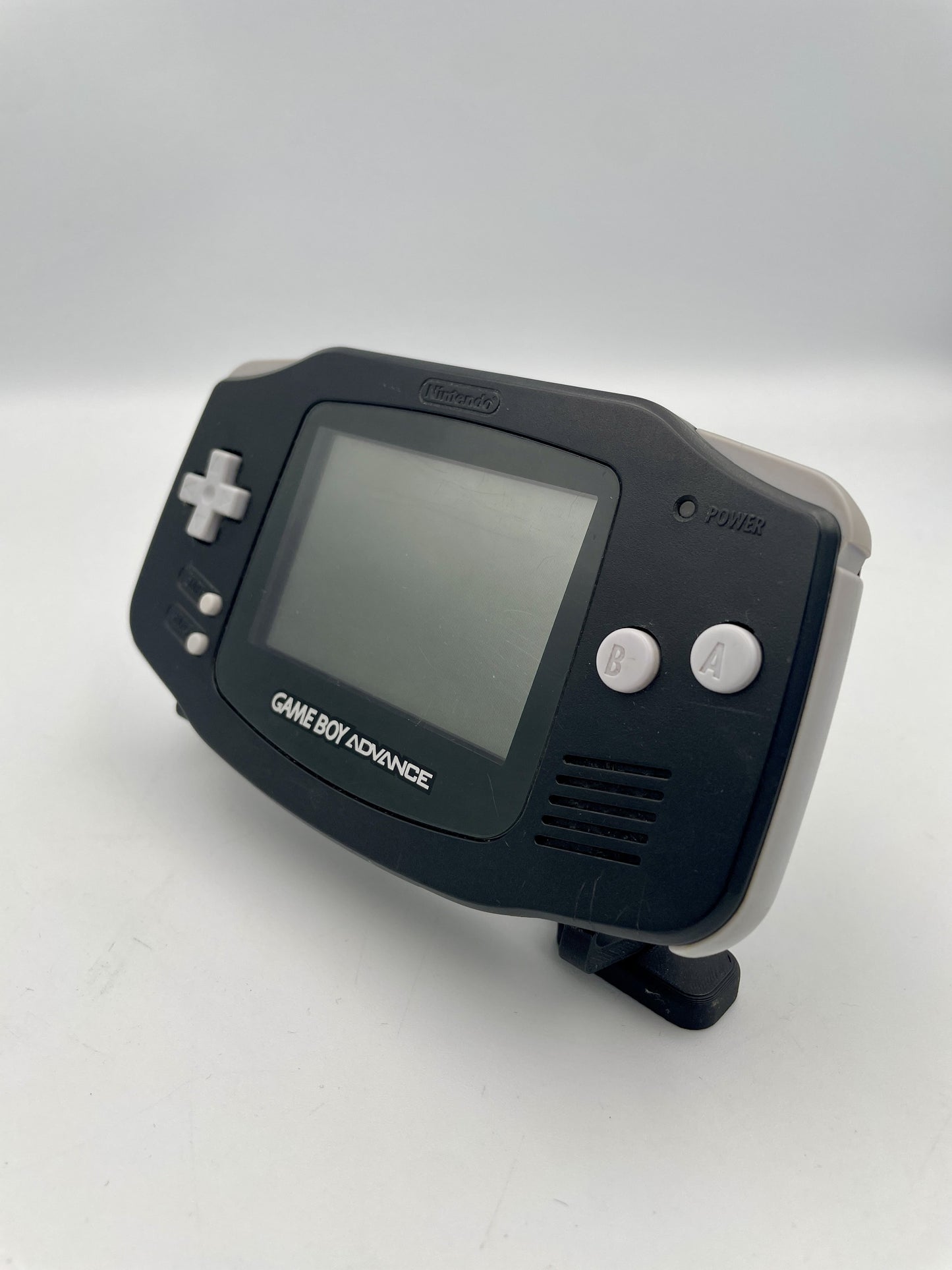 Black Game Boy Advance on a white background