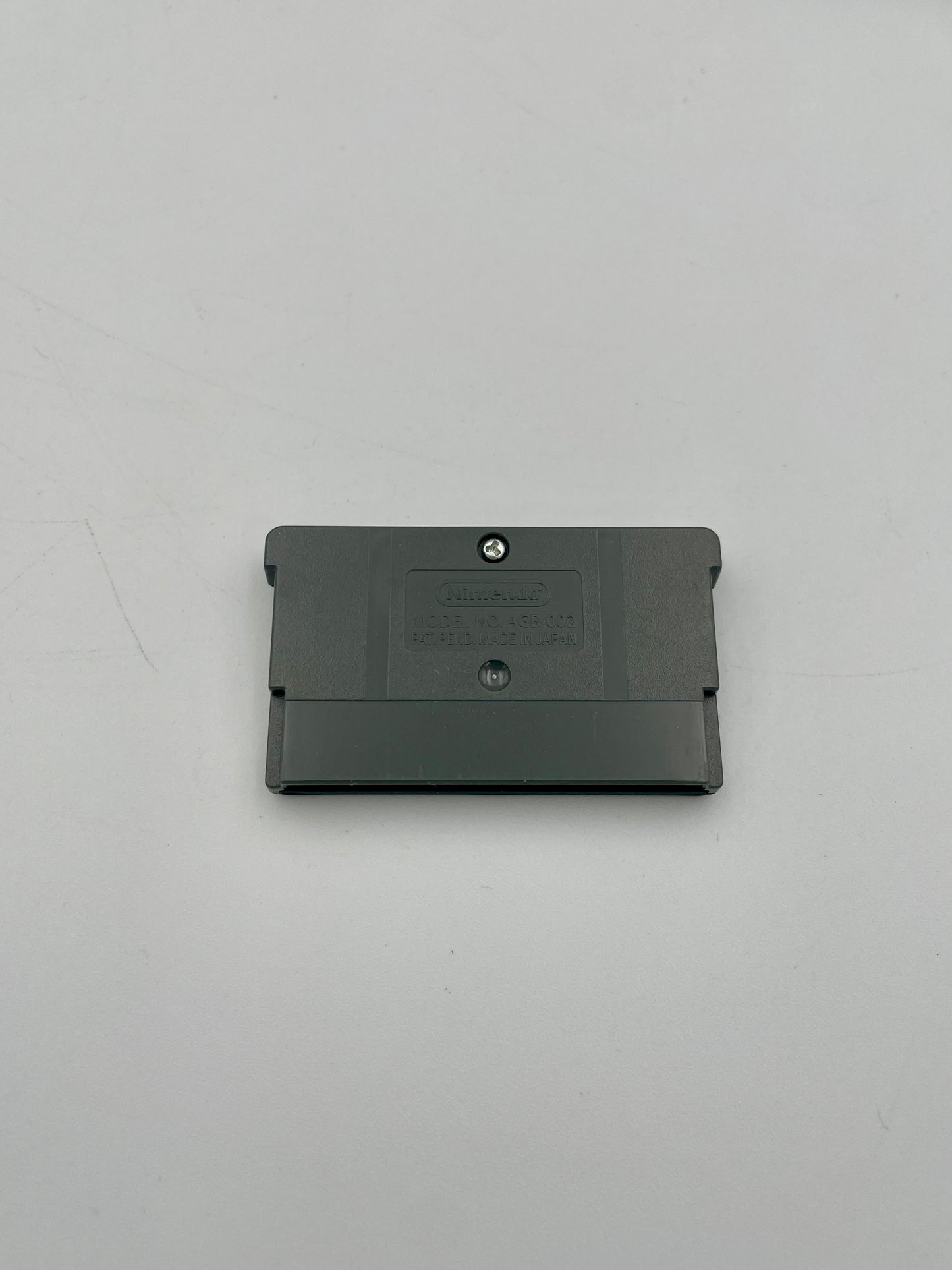 Black rectangular object on a light gray background