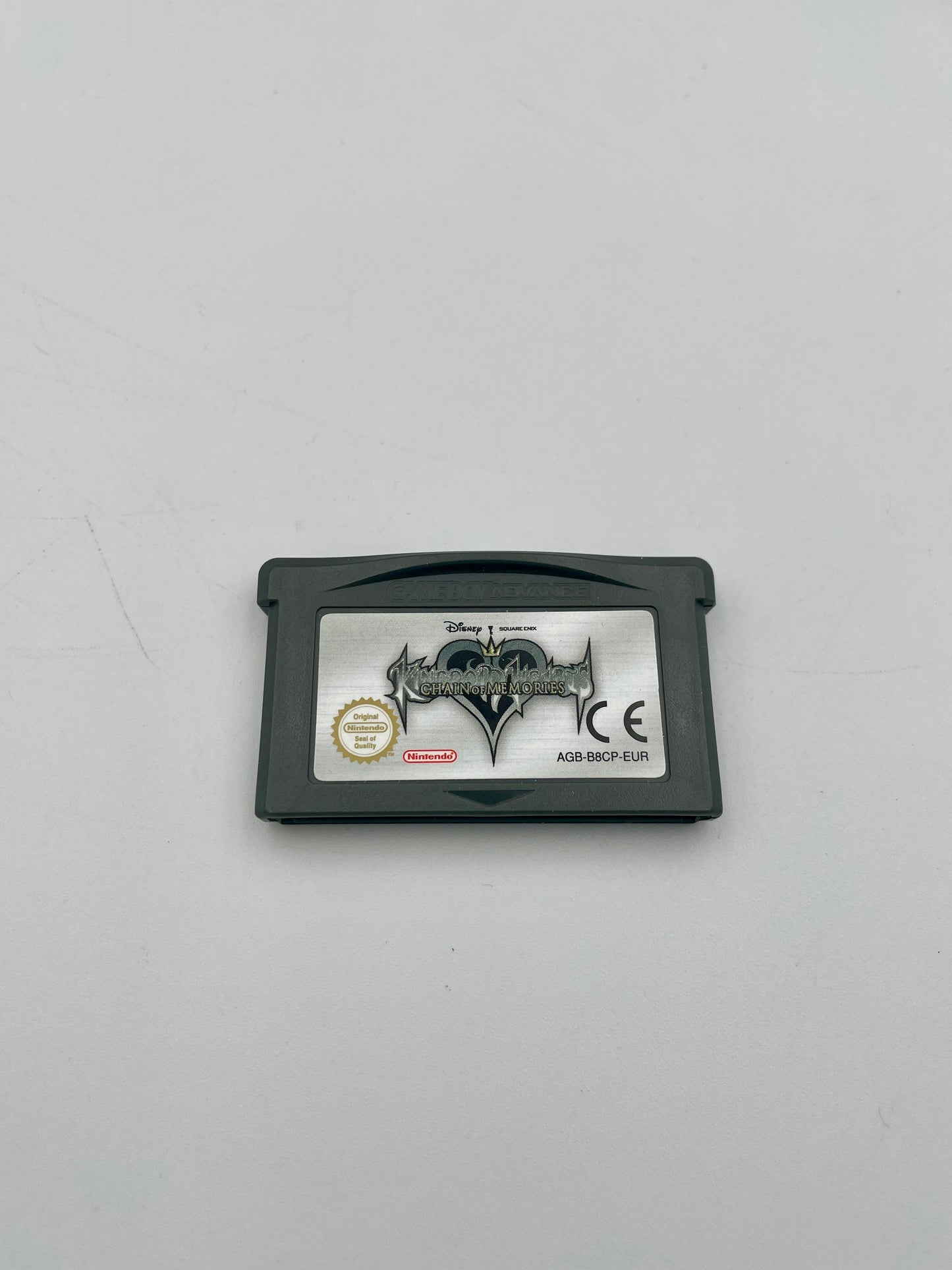 Game cartridge with branding on a gray background
