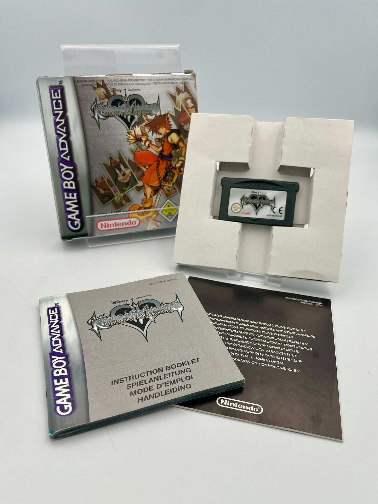 Game Boy Advance game cartridge with packaging and manual on a white background