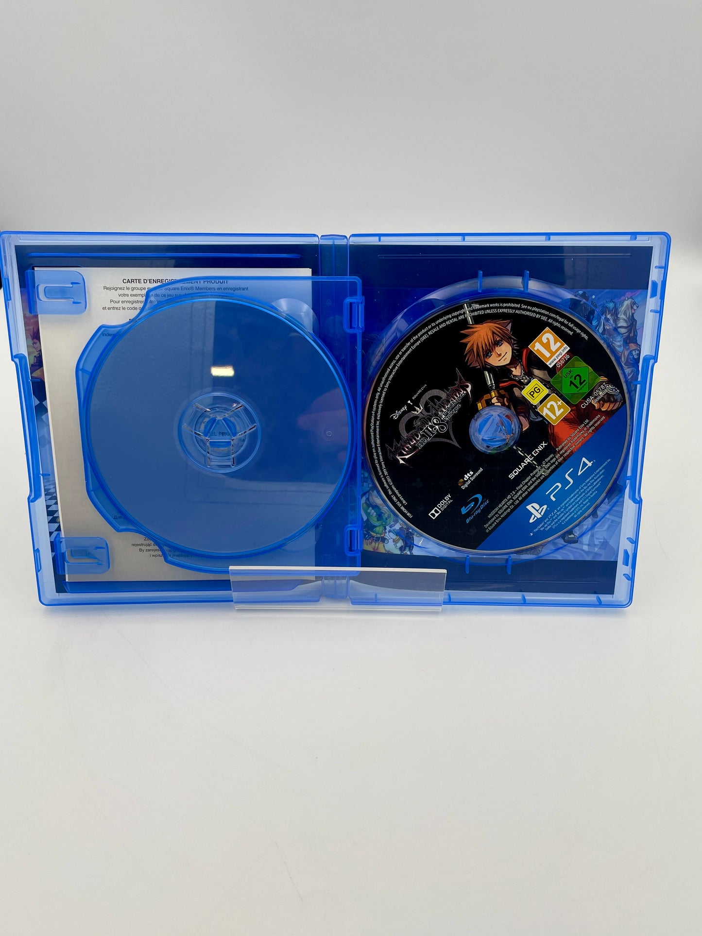 PlayStation 4 game disc in a blue case on a white background