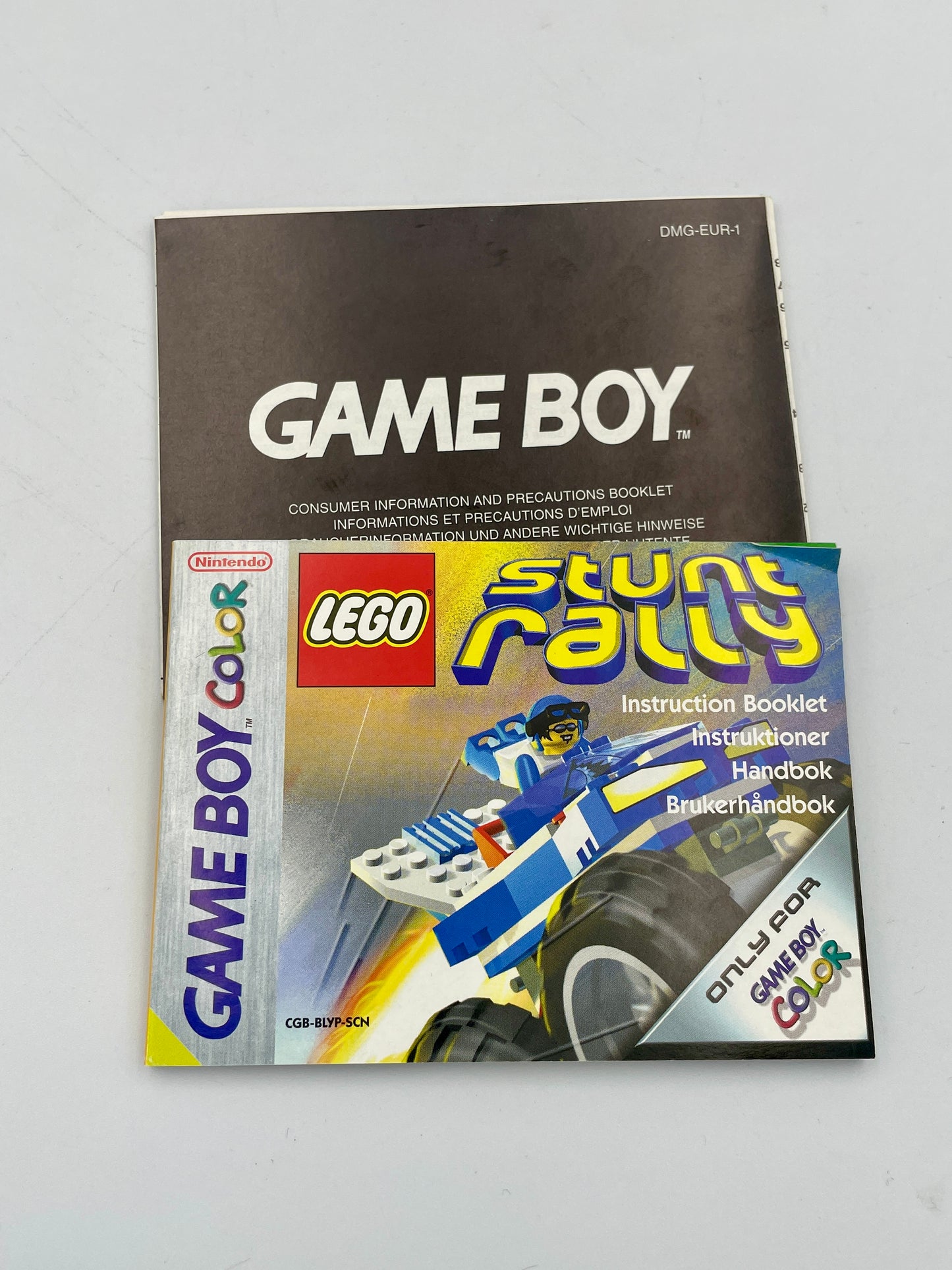 Game Boy Color LEGO Stunt Rally instruction booklet on a gray background