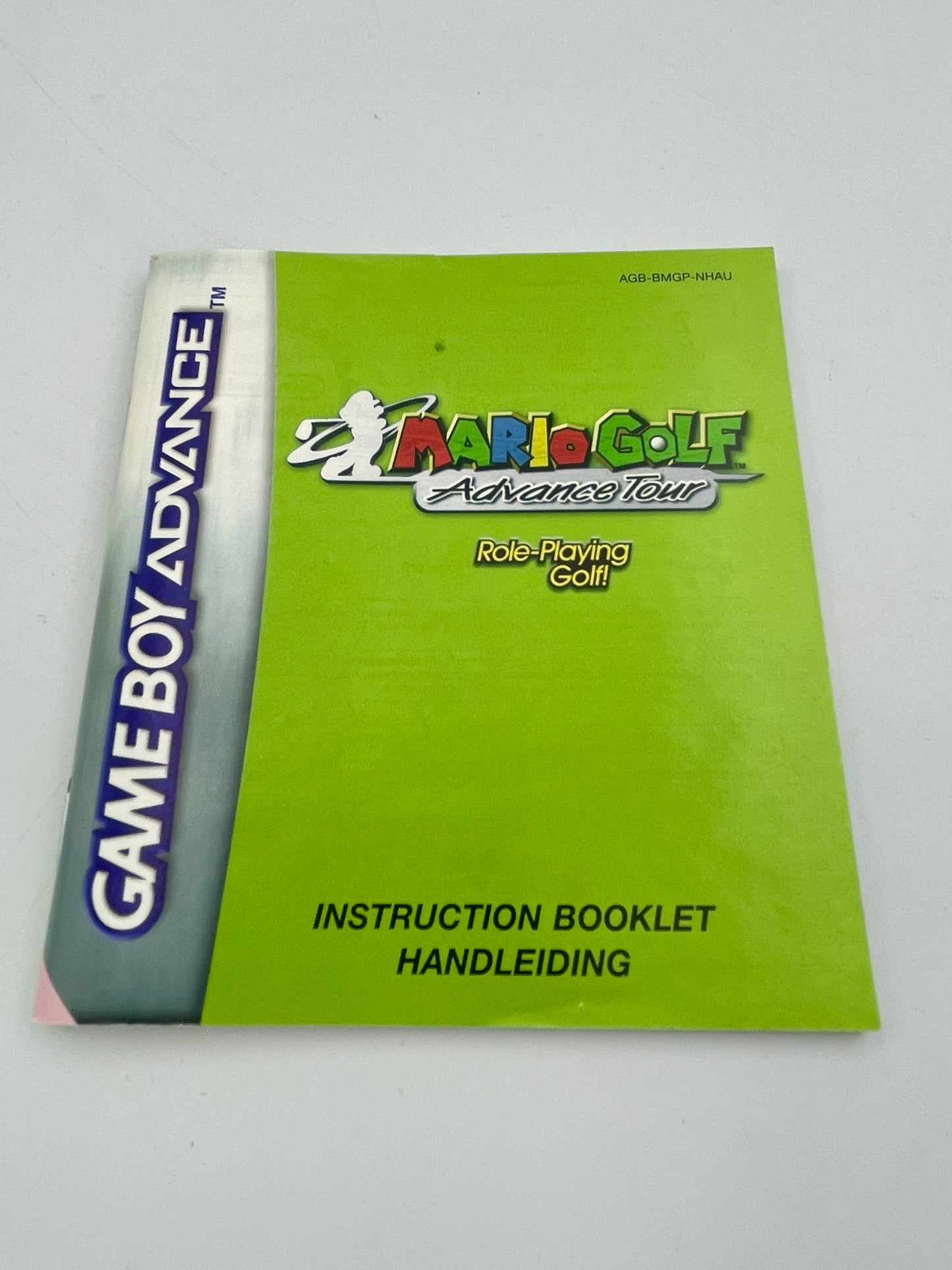 Green instruction booklet for Mario Golf Advance Tour on Game Boy Advance with branding on a white background