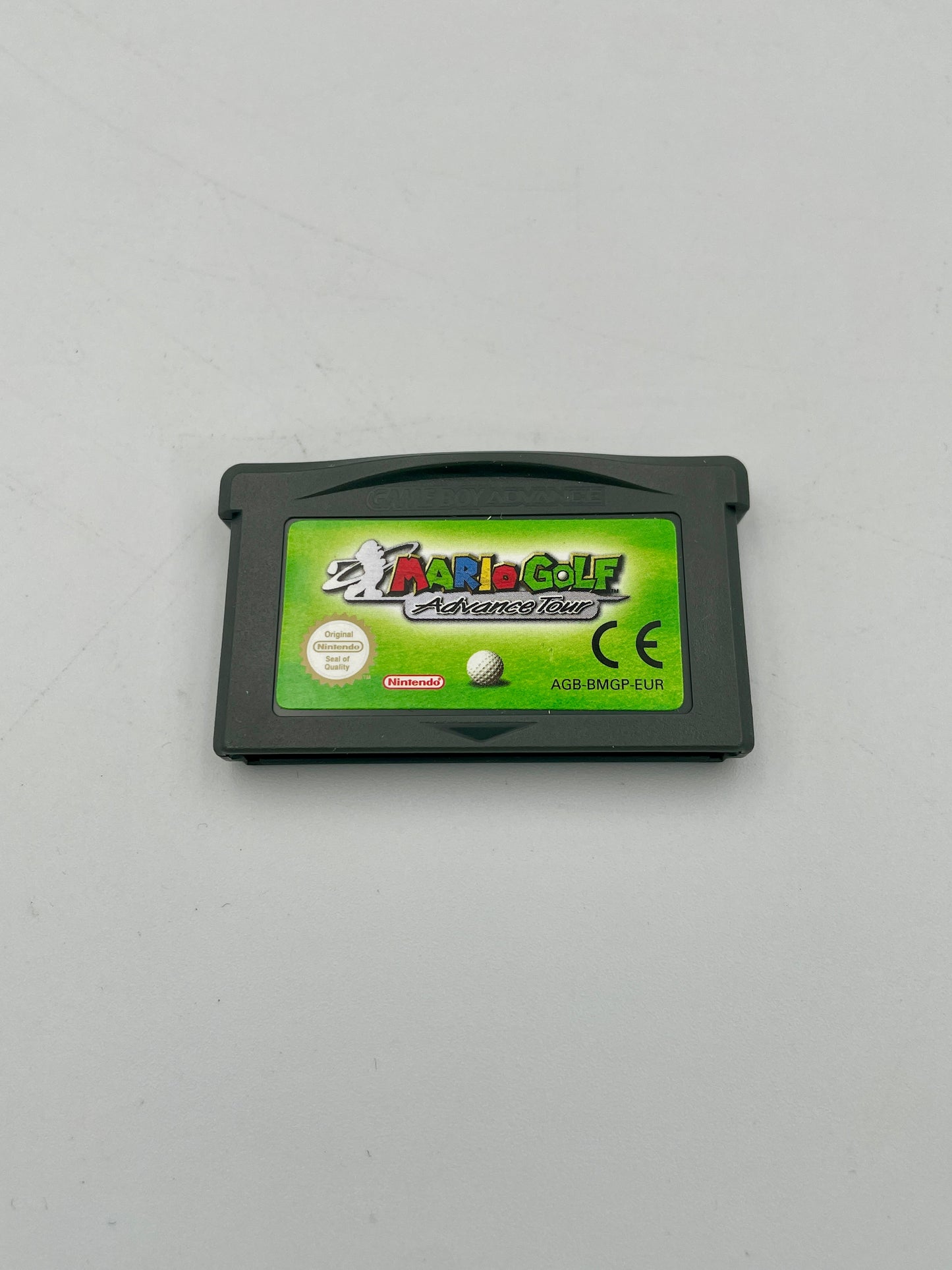 Game cartridge for 'Mario Golf' on a gray background