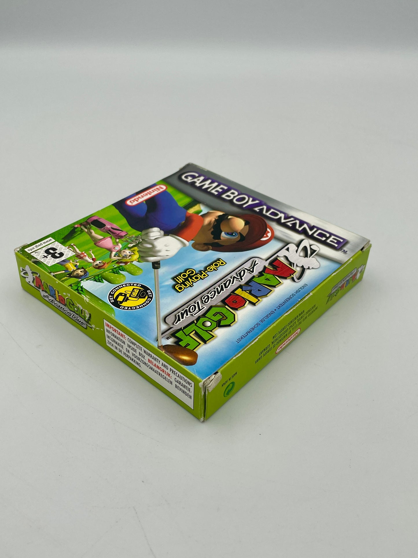 Game Boy Advance cartridge packaging with colorful design on a gray background