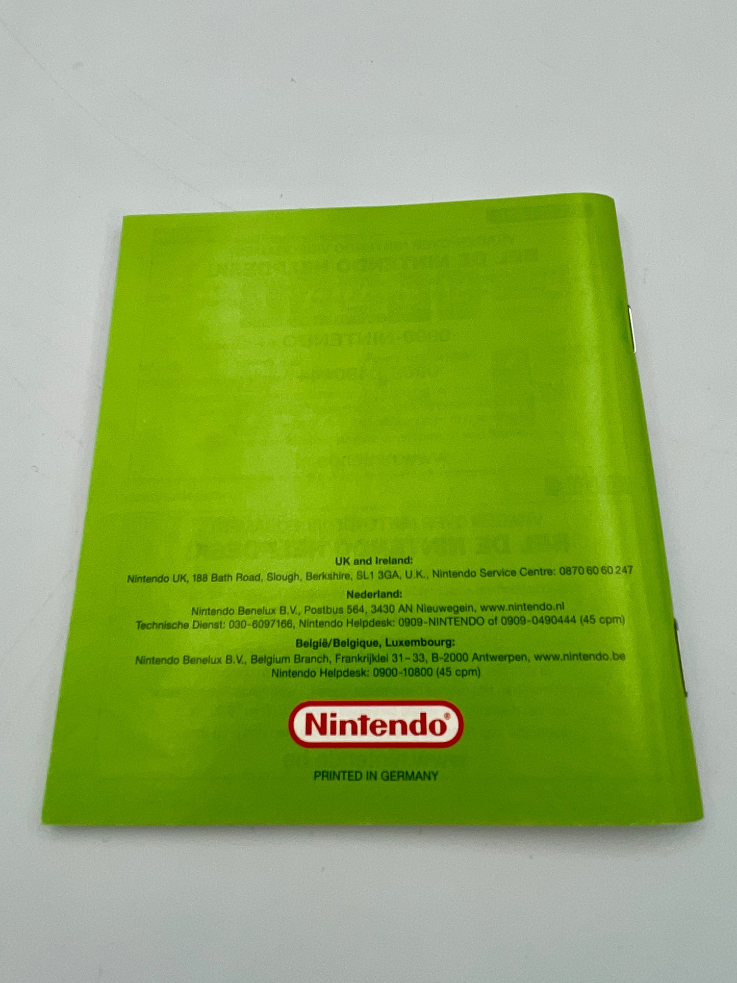 Green Nintendo product with text and logo on a white background