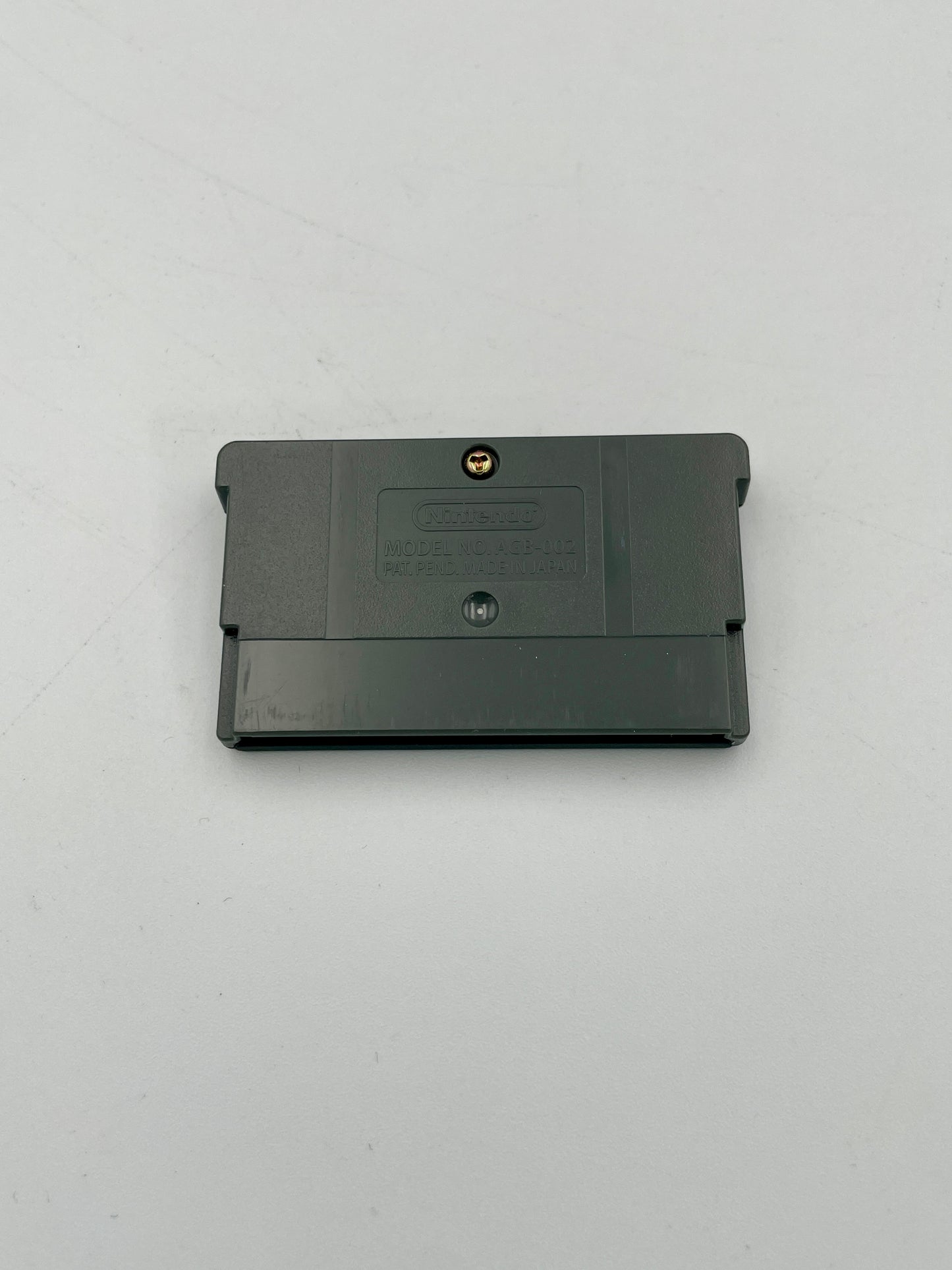Black cartridge on a light gray background