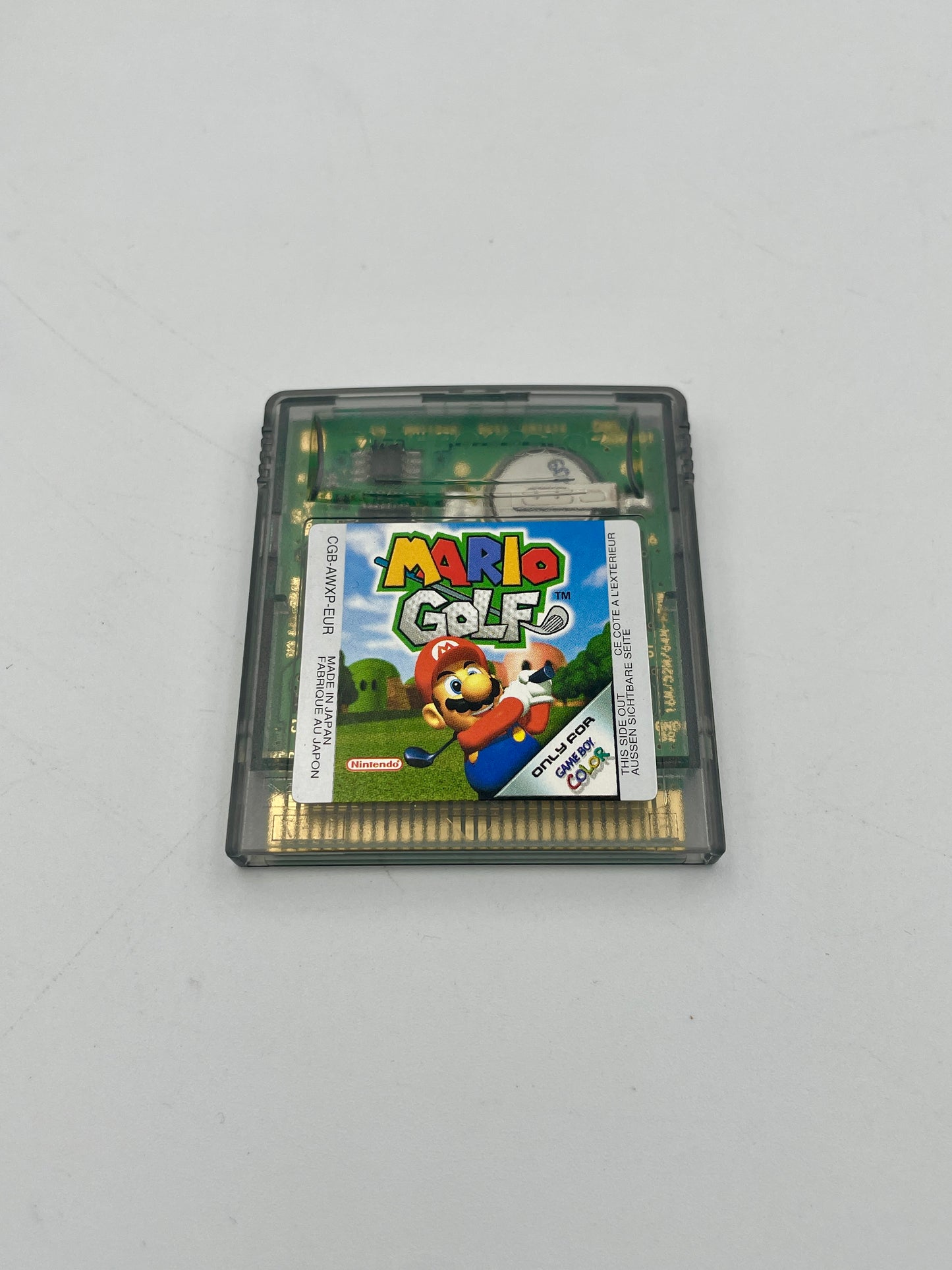 Game cartridge for 'Mario Golf' on a gray background