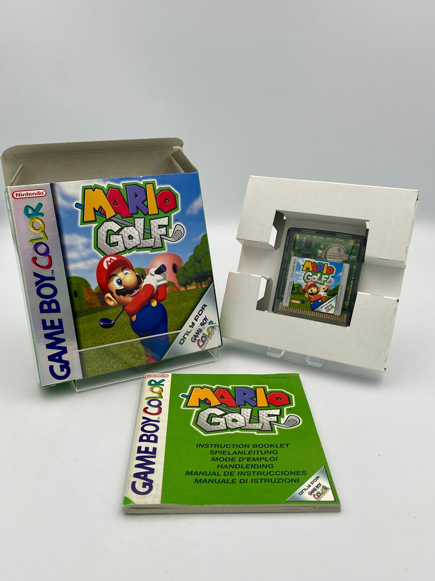 Nintendo Game Boy Color Mario Golf game with packaging and manual on a white background