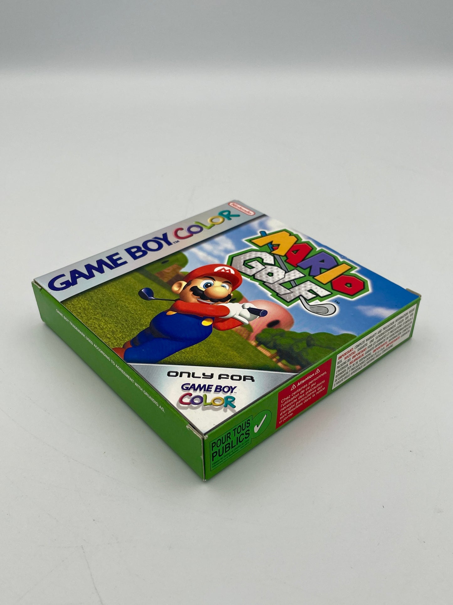 Game Boy Color game cartridge with Mario and Yoshi on a green field