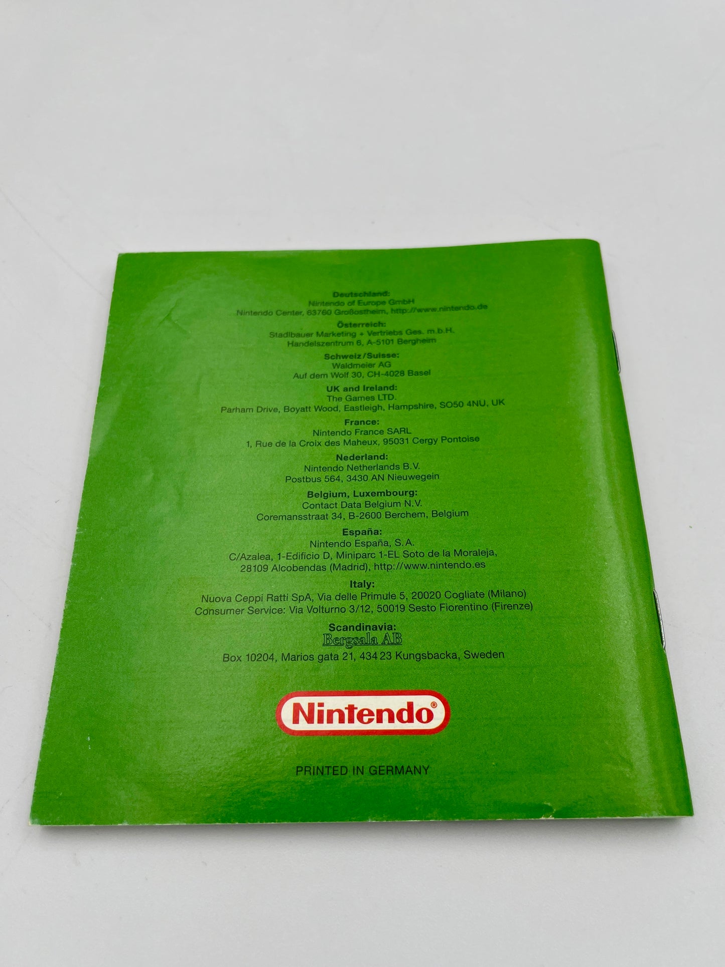 Green Nintendo product with text and logo on a white background