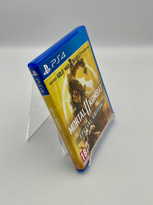 Mortal Kombat Special Edition game case for PS4 on a gray background