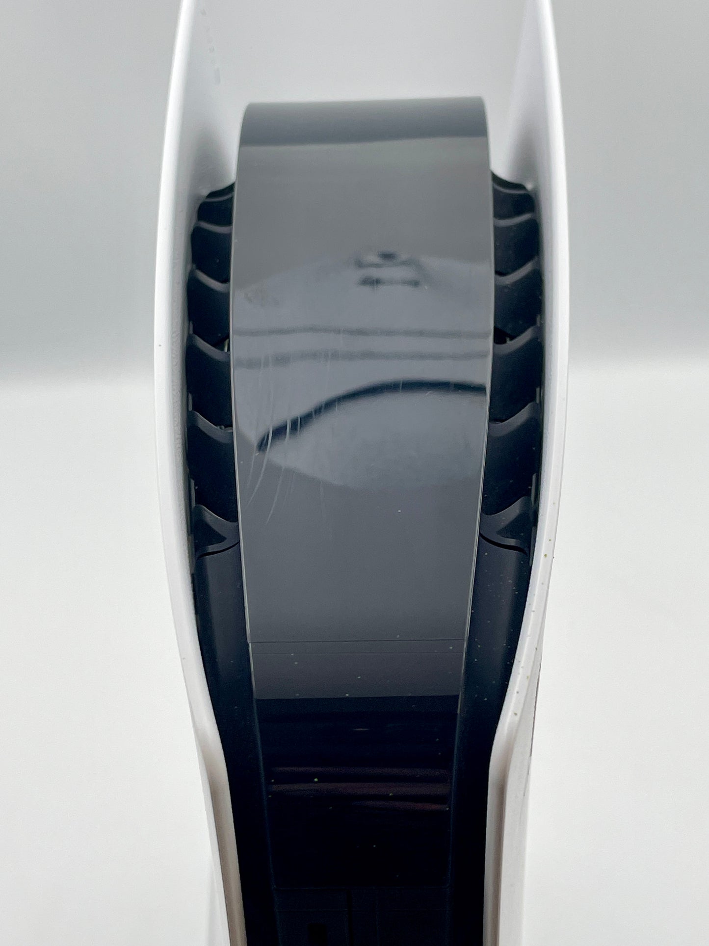 Close-up of a cylindrical electronic device with a reflective surface