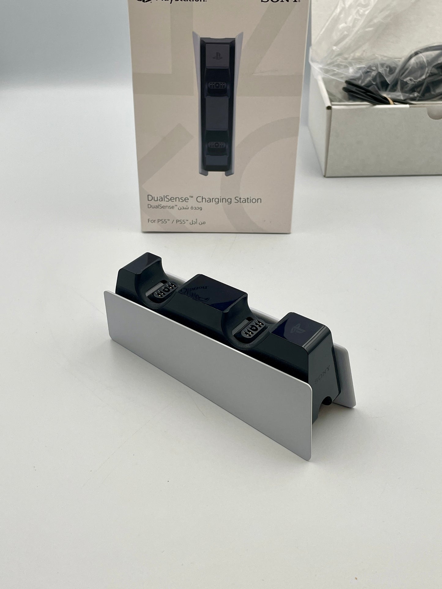 Sony DualGaming Charging Station on a white surface with packaging in the background