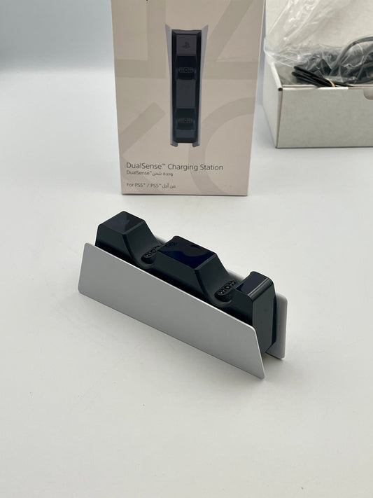 DualSense charging station with packaging on a white background