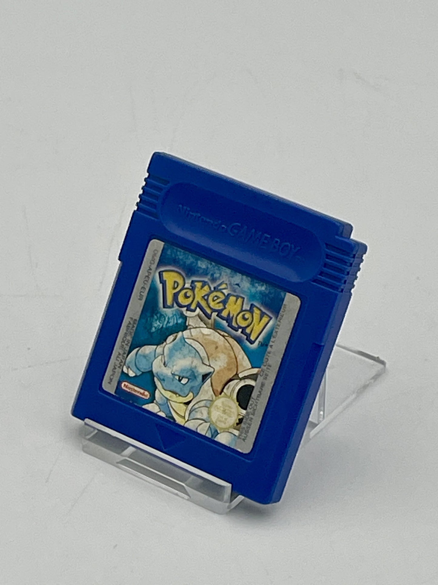 Blue Game Boy cartridge with a Pokémon game on a white background