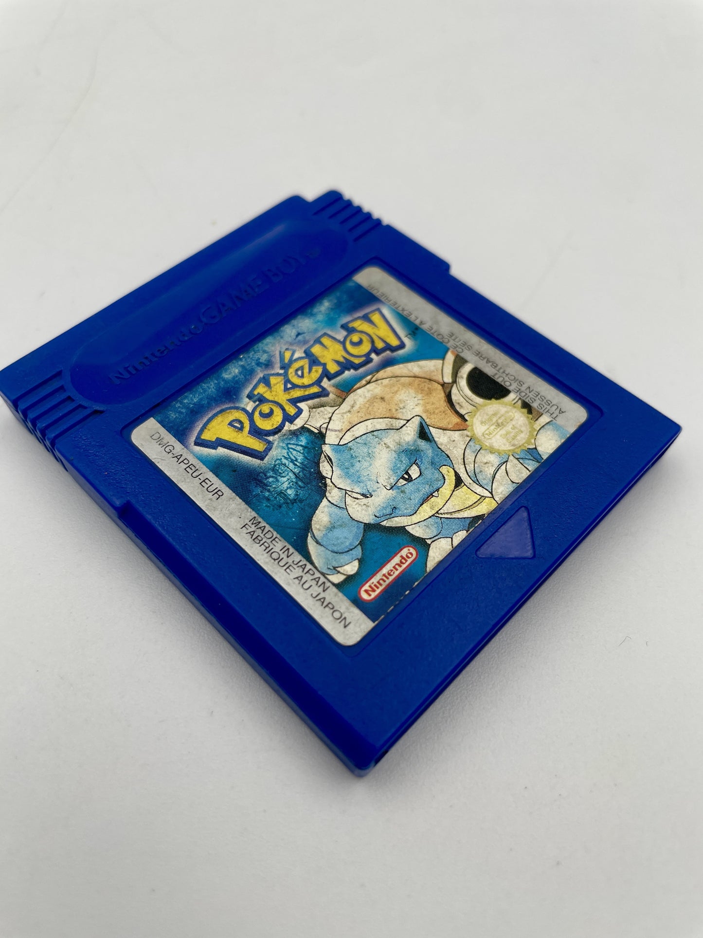 Blue Game Boy cartridge with a Pokémon game on a white background