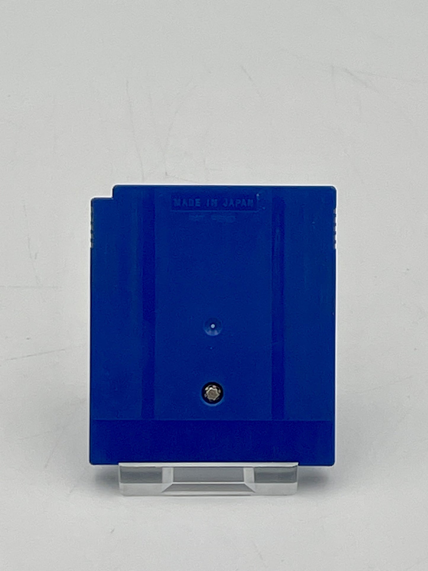 Blue rectangular object with a label on a gray background