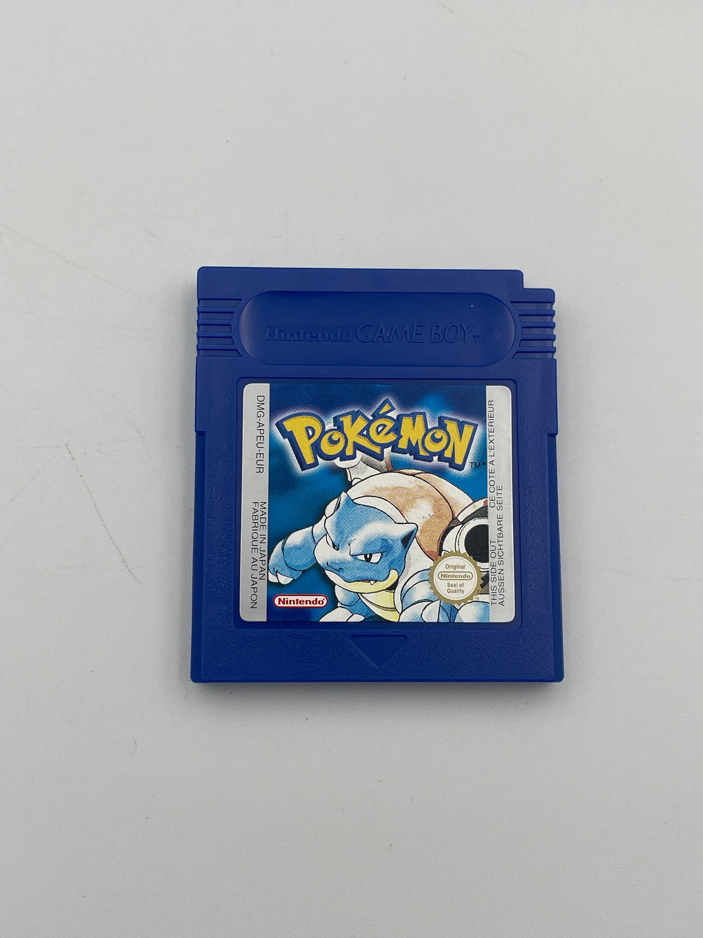 Blue Game Boy cartridge with a Pokémon logo on a gray background
