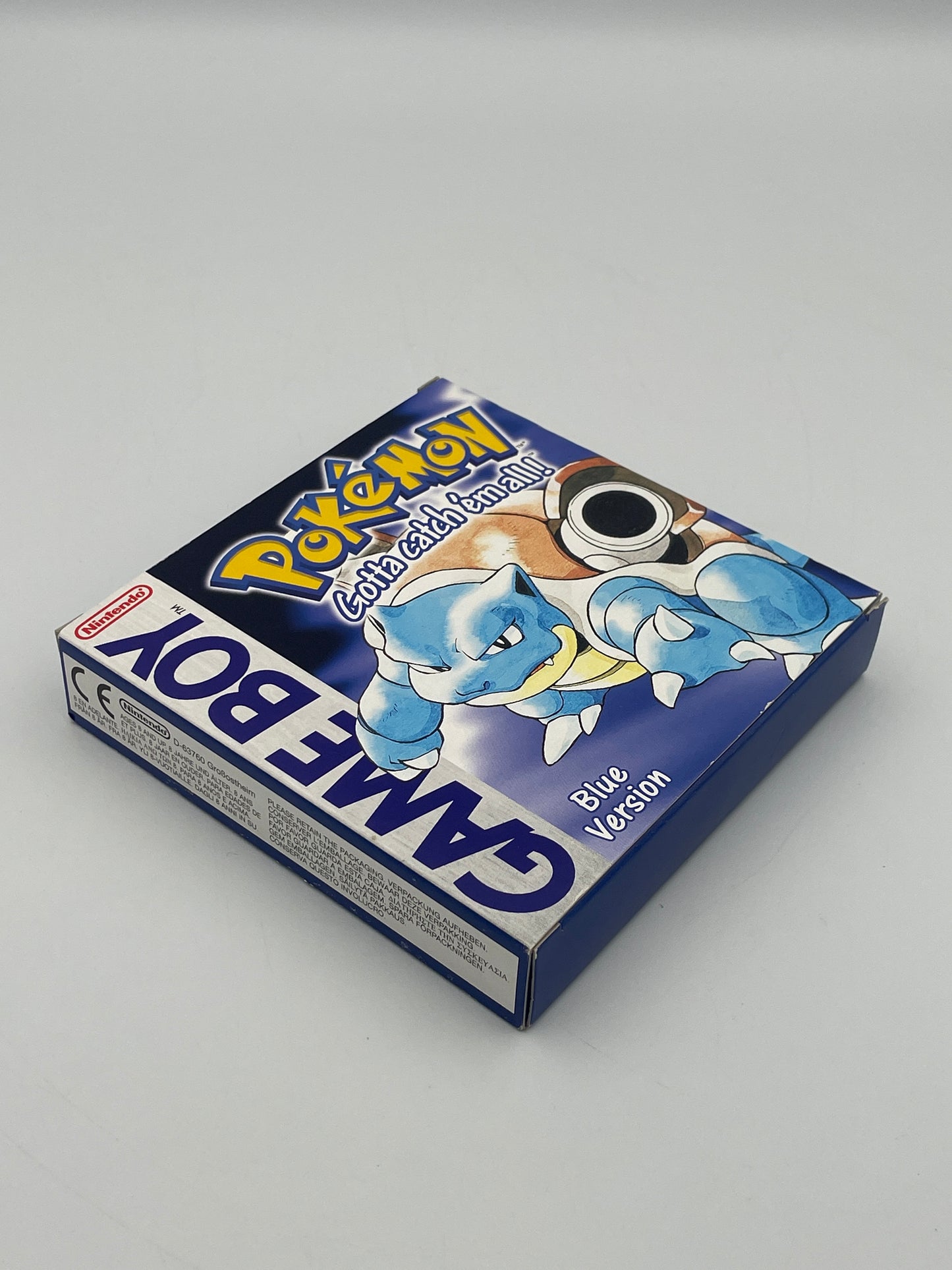 Game Boy Color blue game console with cartoon character on a gray background