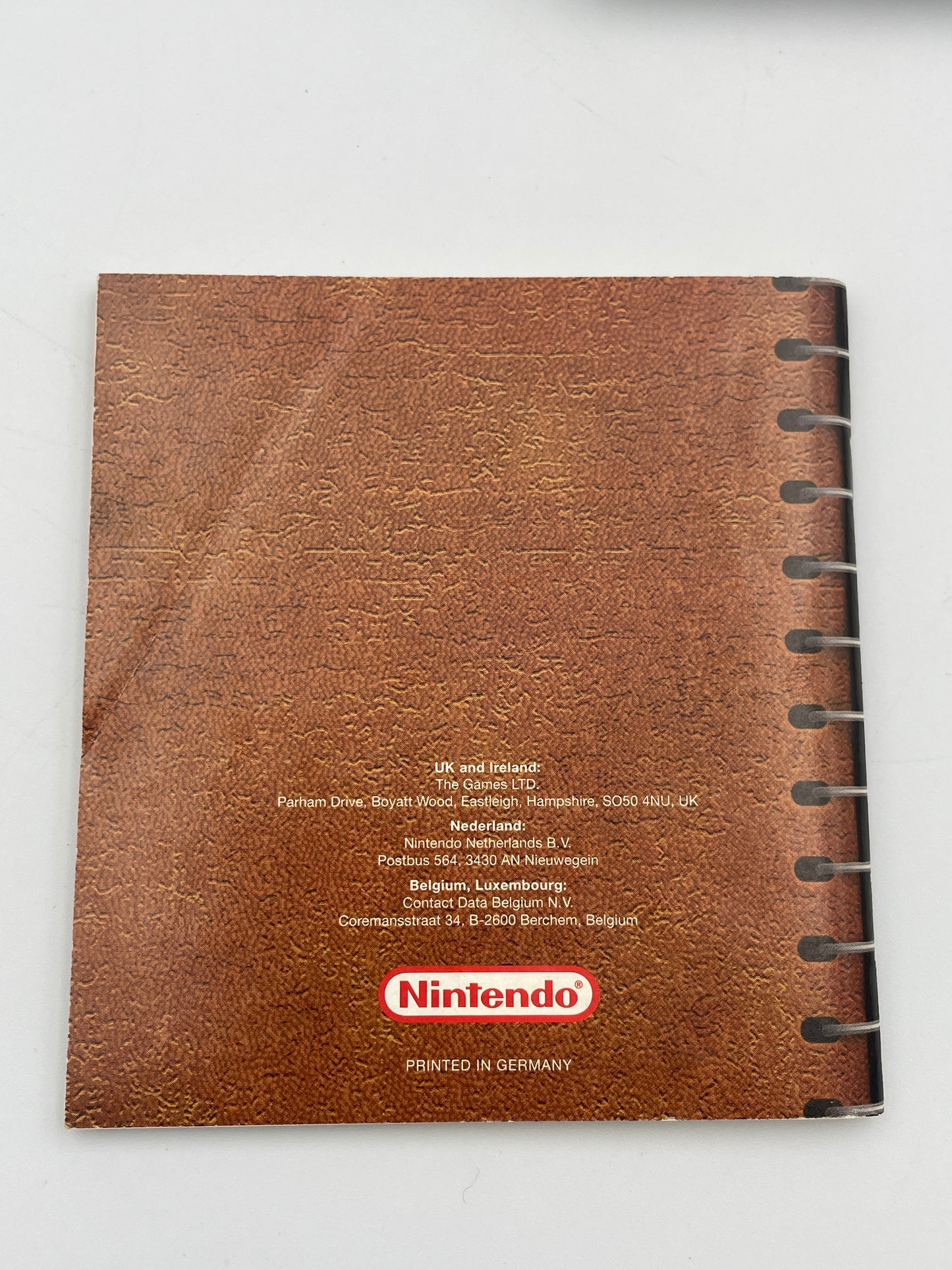 Brown notebook with Nintendo logo on a white background
