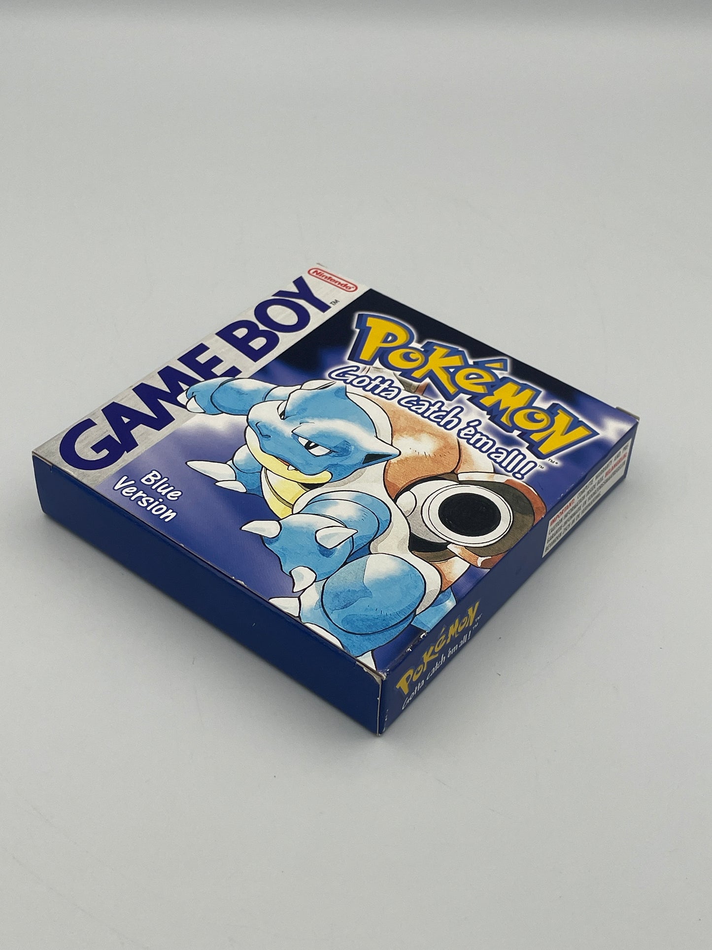 Blue version of a Pokémon trading card game box on a gray background