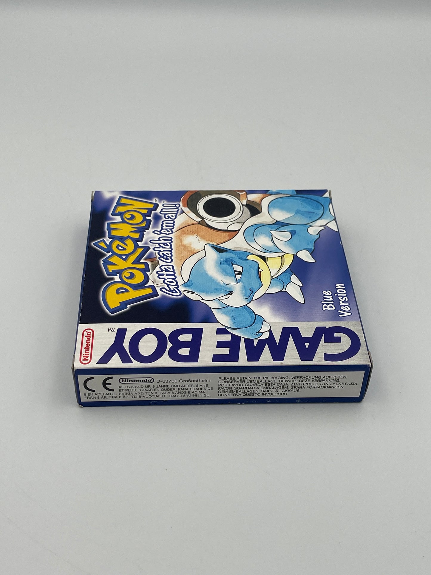 Pokémon Game Boy Blue Edition packaging on a gray background