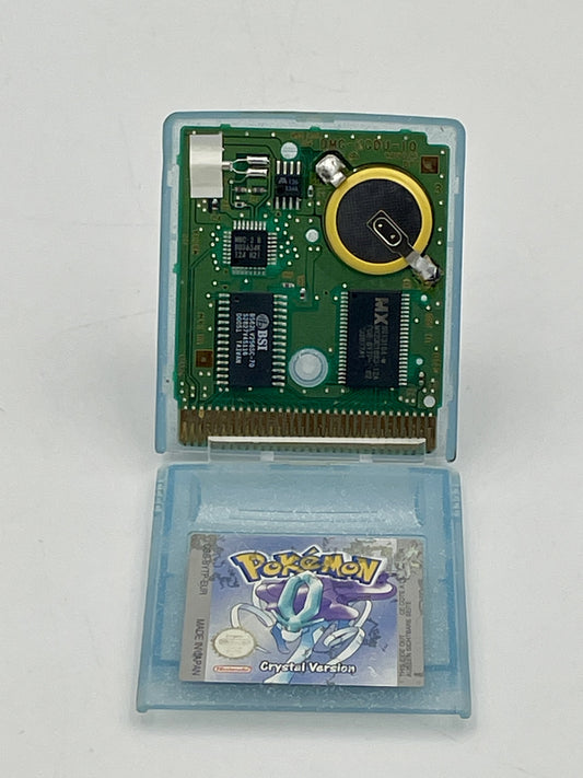 Game cartridge with electronic components and a 'Pokémon' game card on a white background
