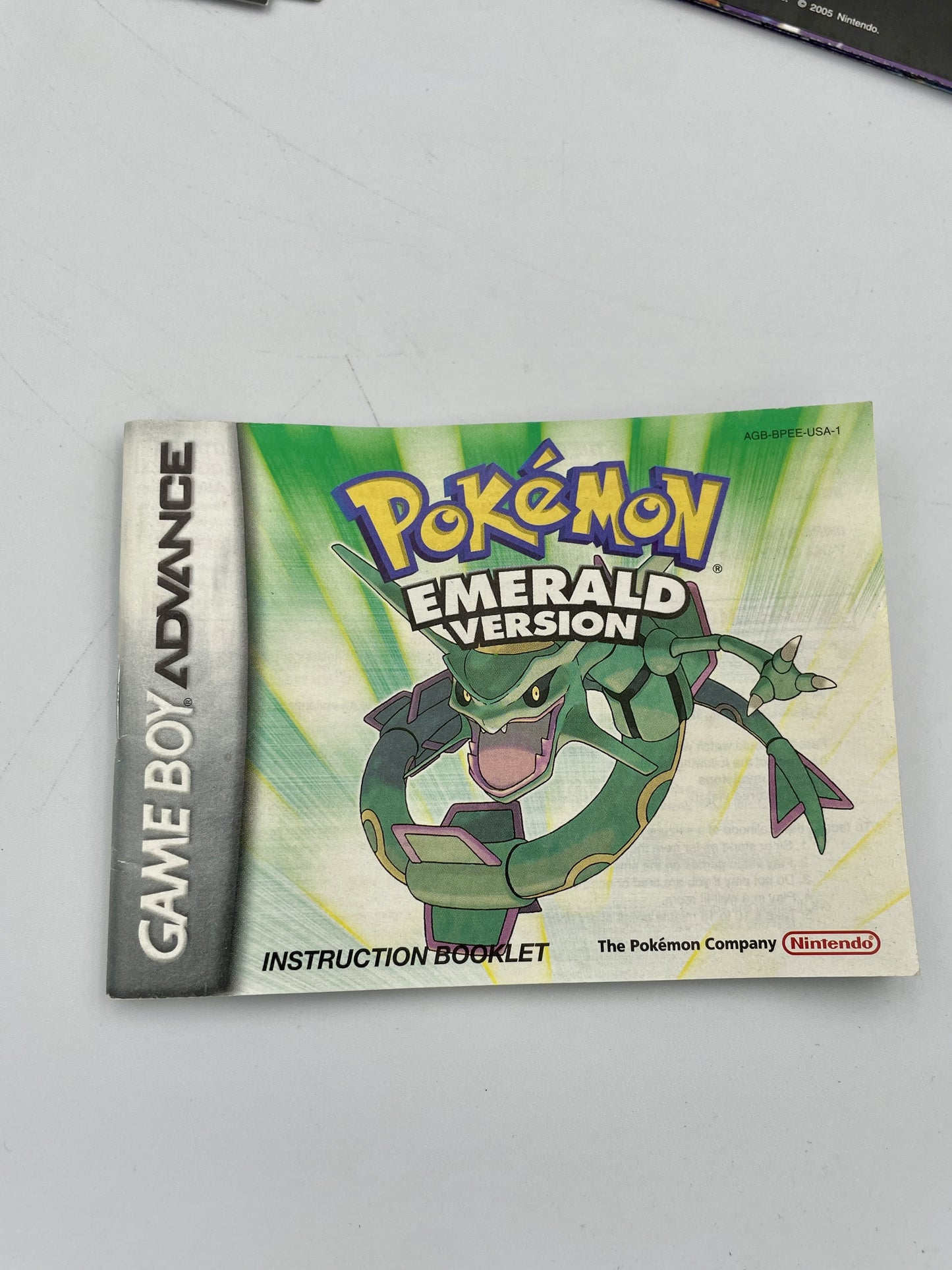 Pokémon Emerald Version Game Boy Advance instruction booklet on a gray background