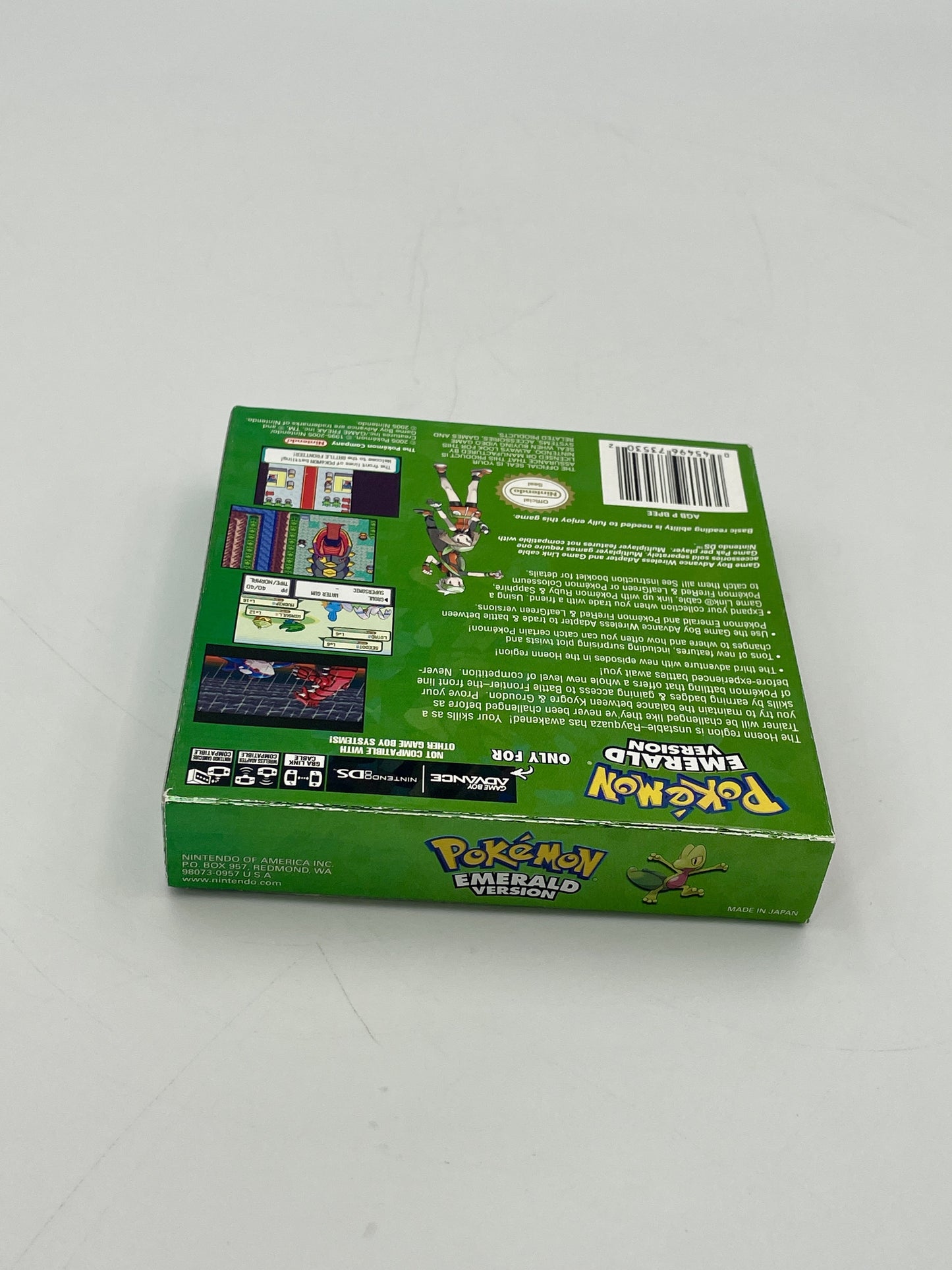 Green trading card game box with Pokémon branding on a white background