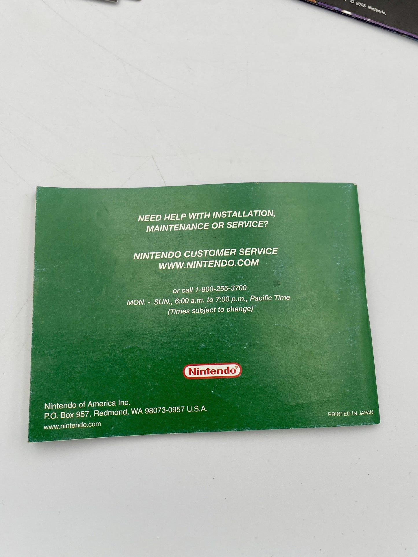 Green Nintendo customer service card on a white background