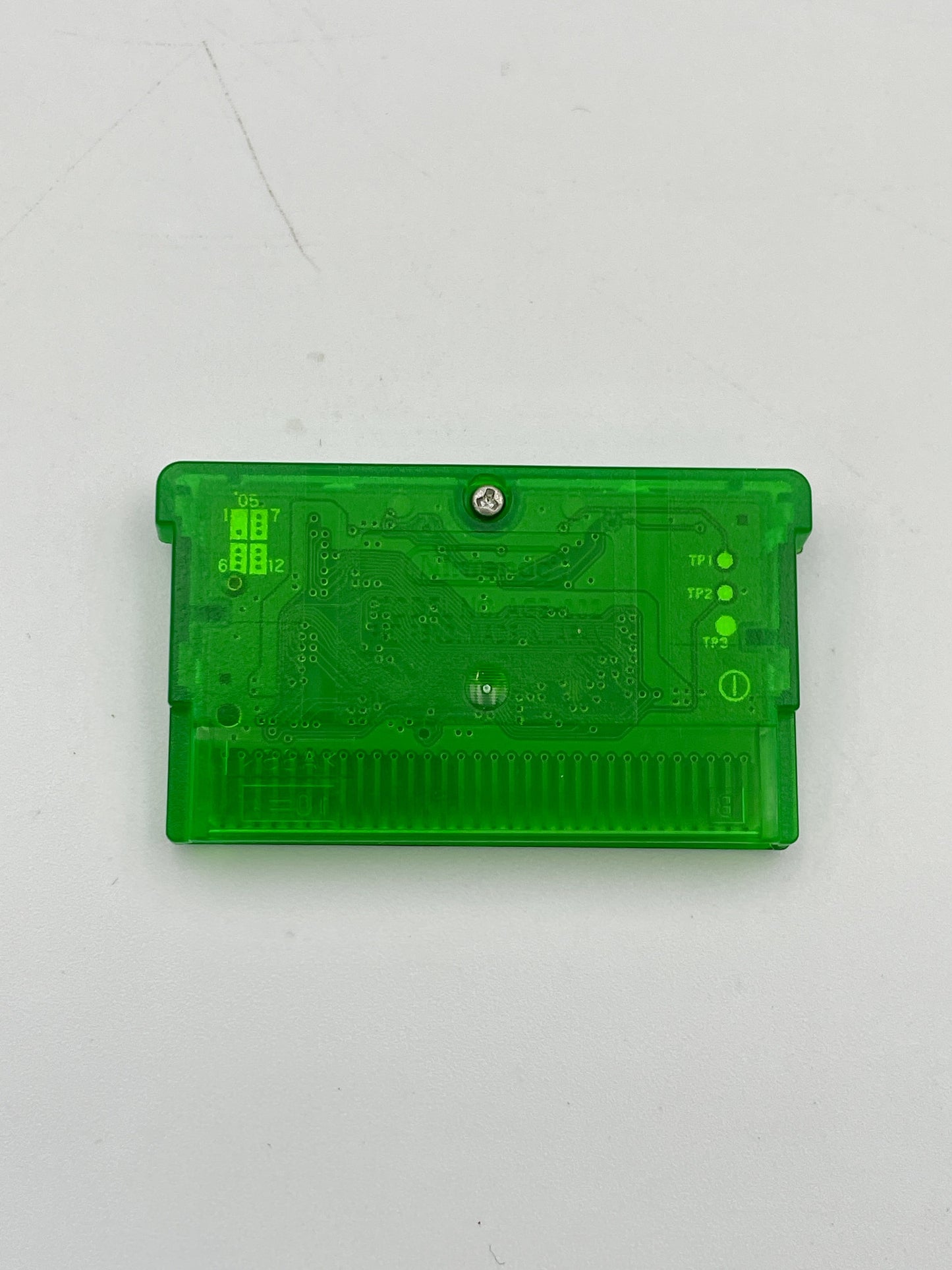 Green electronic component on a white background