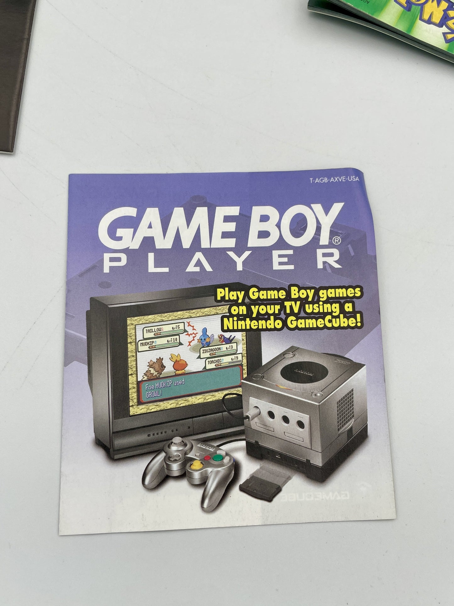 Advertisement for Game Boy Player on a white surface