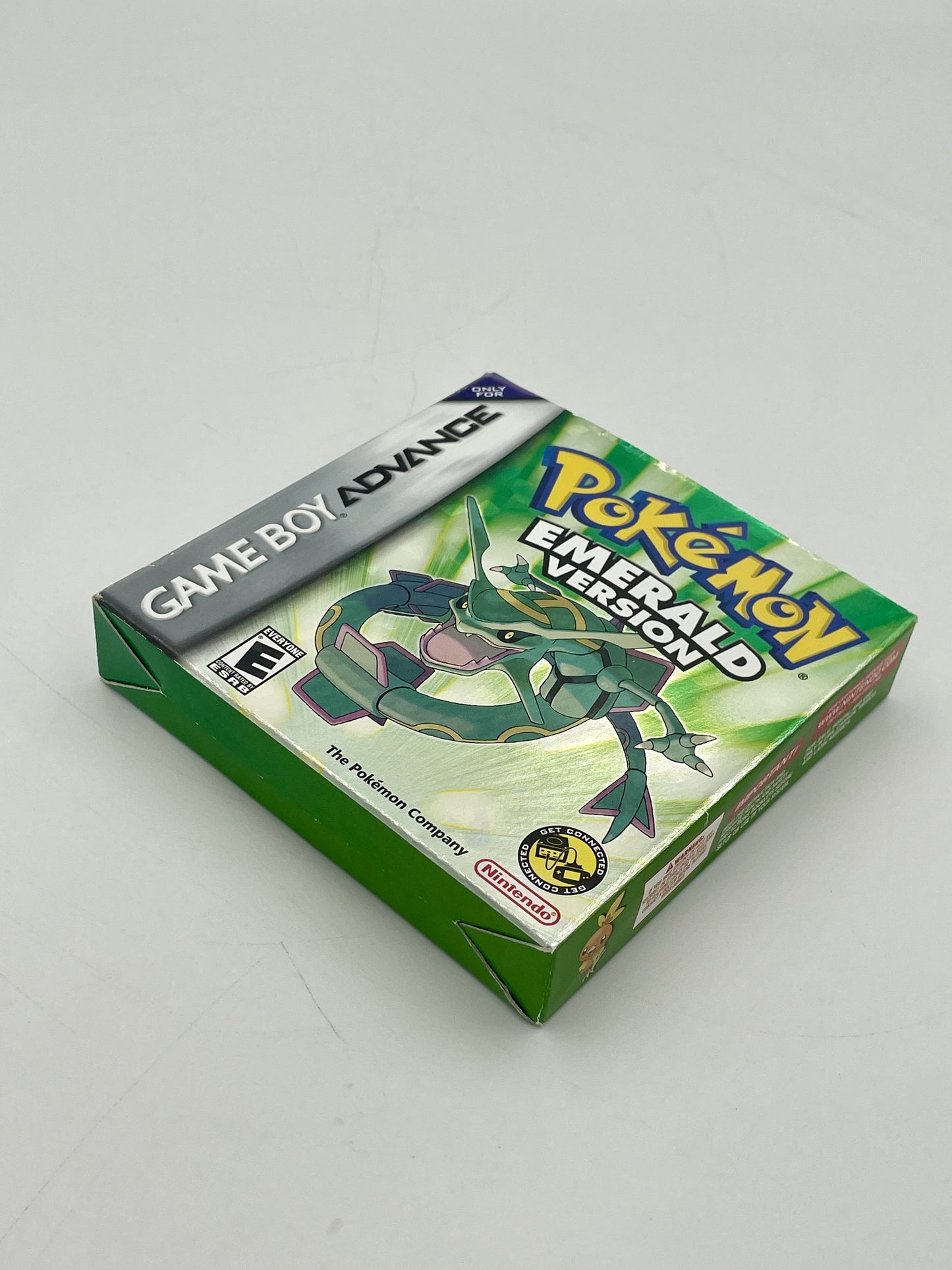 Pokémon Emerald Version Game Boy Advance game case on a white background