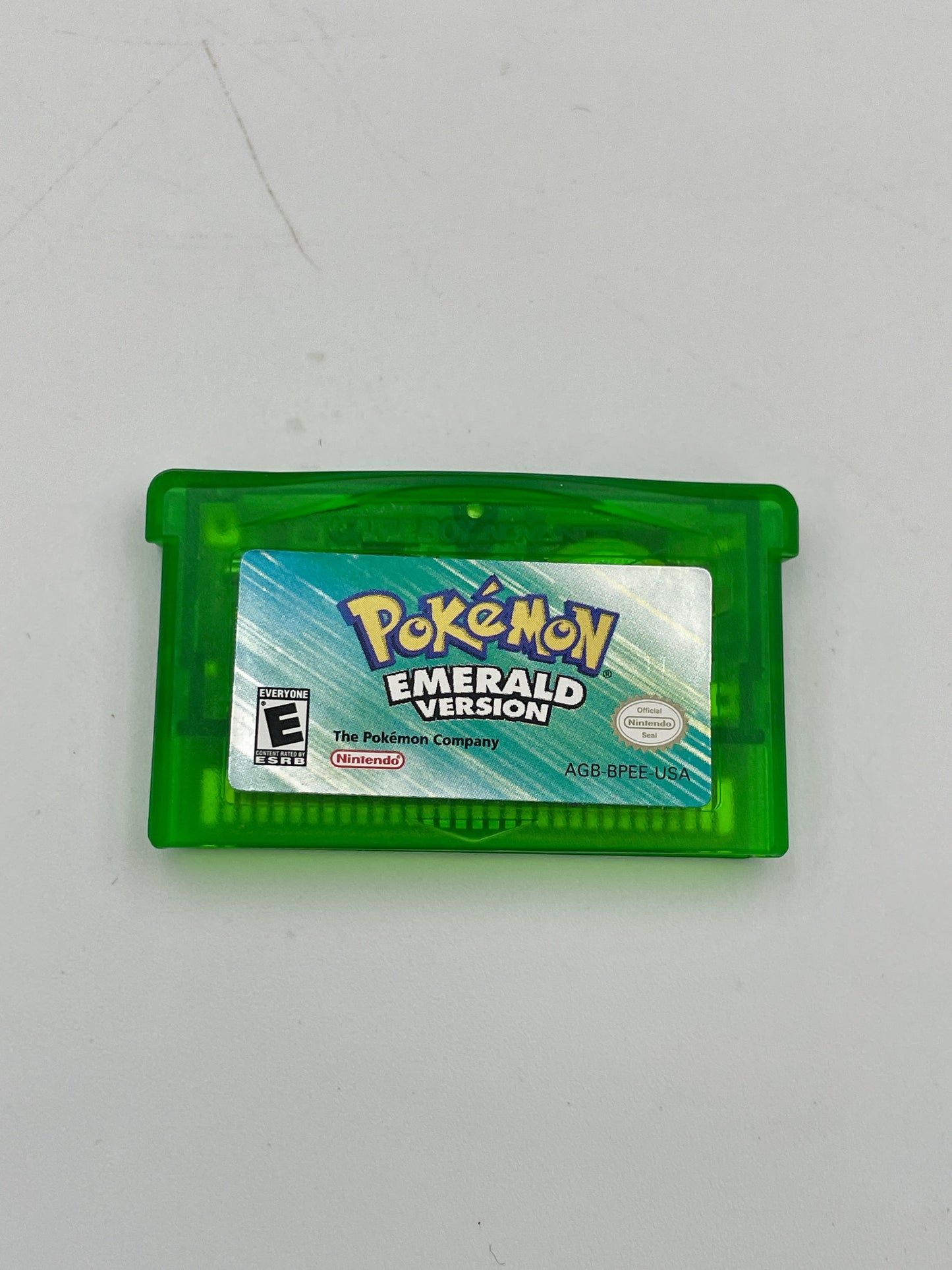 Pokémon Emerald Version game cartridge on a white background