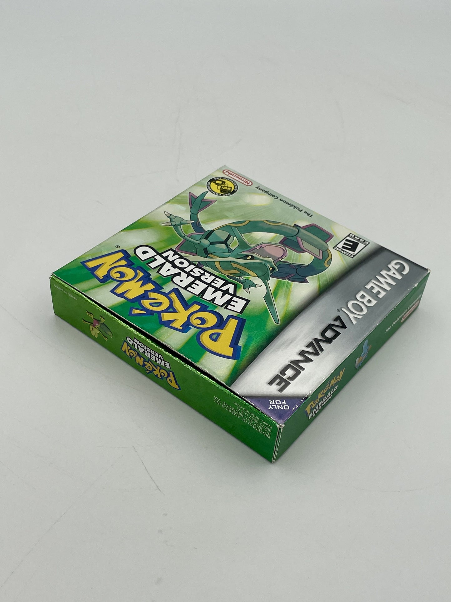 Pokémon Game Boy Advance packaging with a green and white design on a gray background