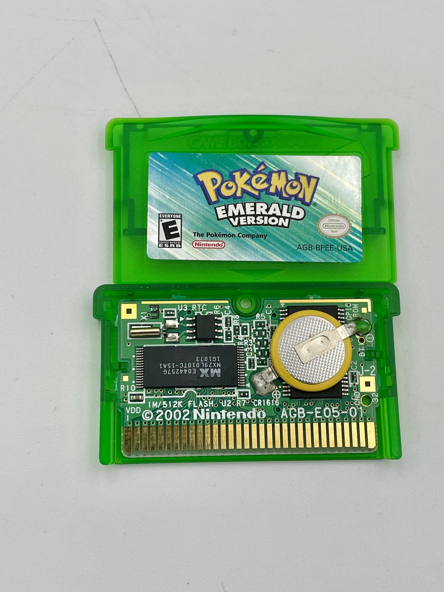 Pokémon Emerald Version game cartridge on a white background