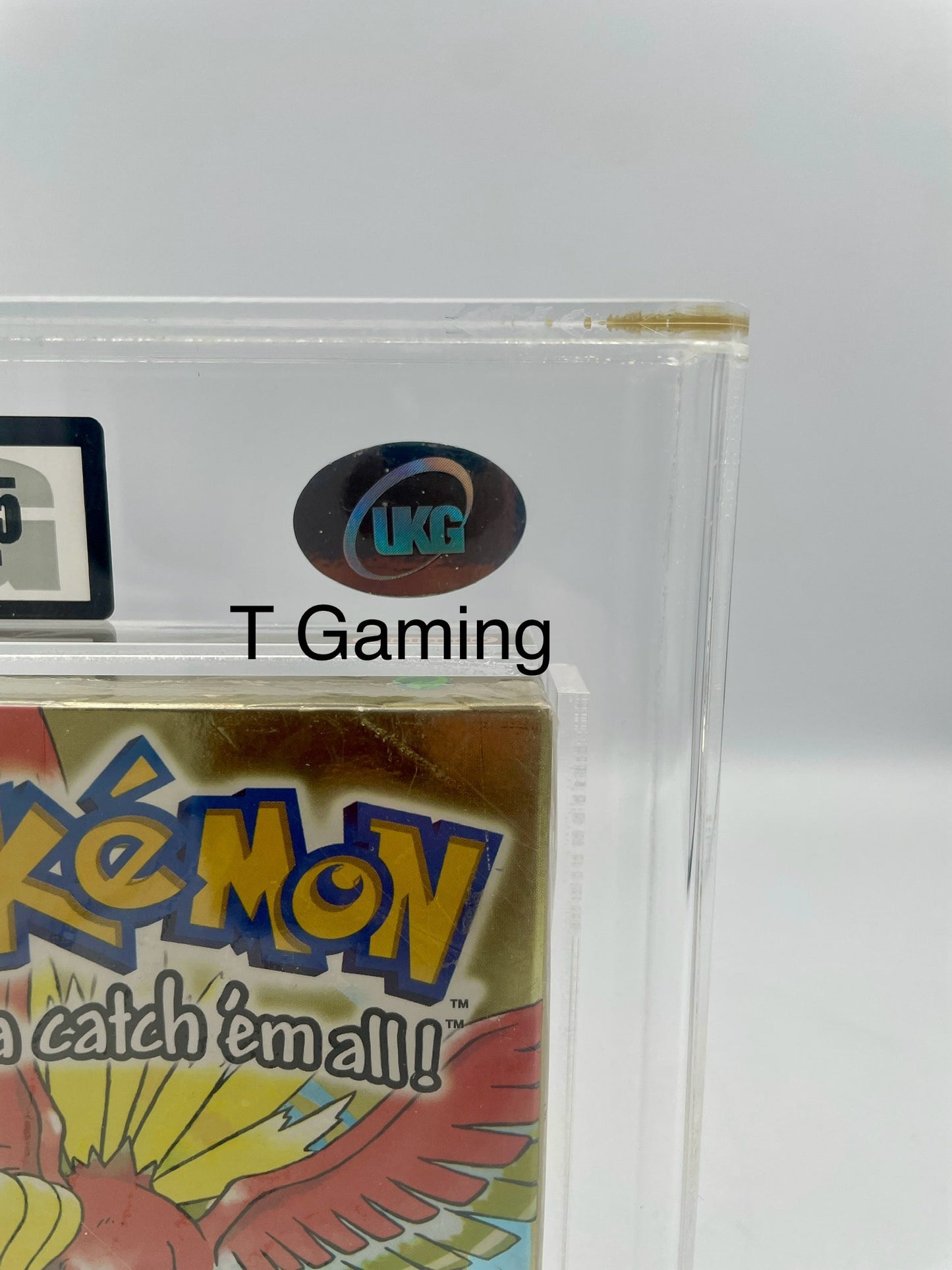 Pokémon trading card game packaging with T Gaming branding on a white background