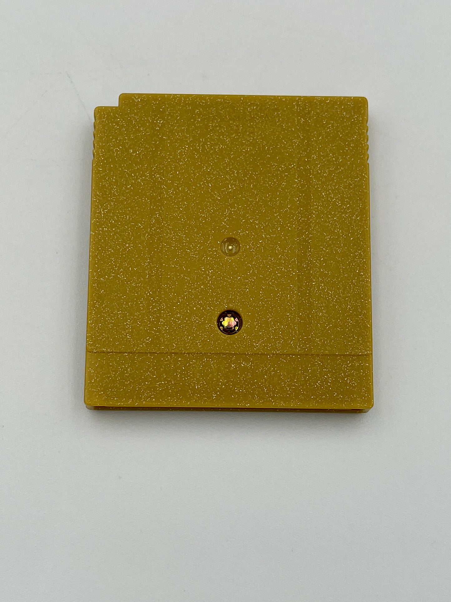 Two gold glittery cards with a central button on a light gray background
