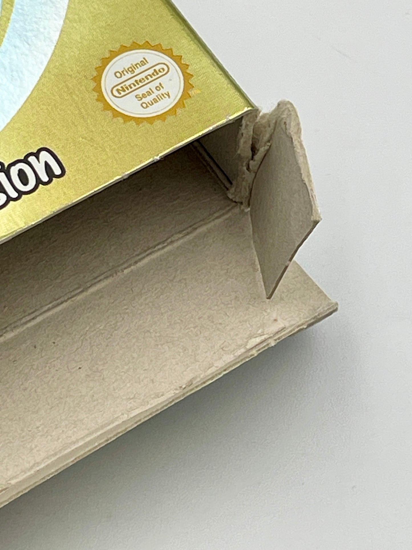 Close-up of a cardboard box with a 'Nintendo' logo on a white background