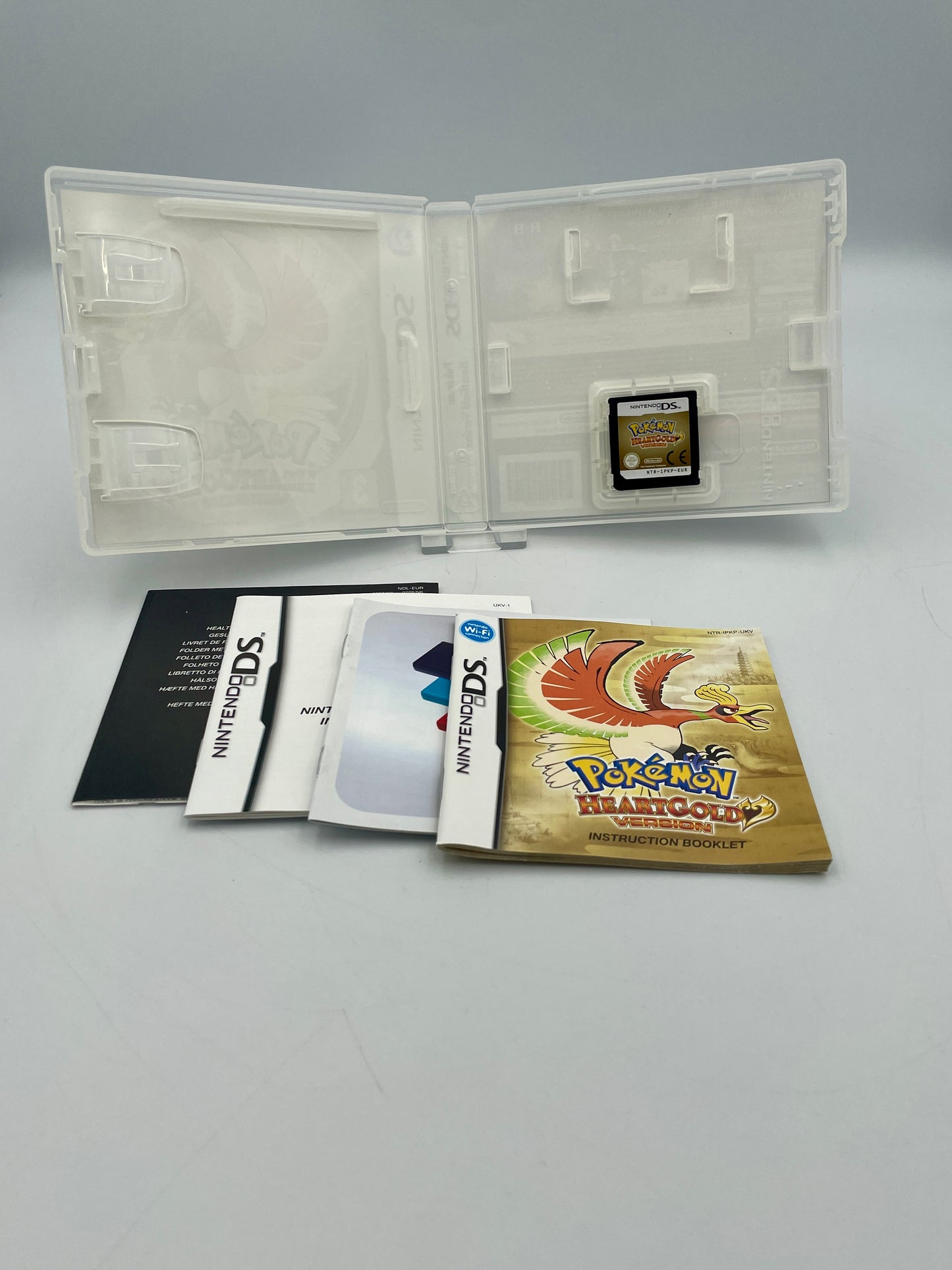 Nintendo DS game case with 'Pokémon Stadium' and 'Pokémon Stadium Gold' on a gray background