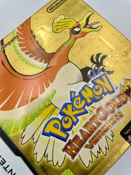 Pokémon HeartGold Version game case with a bird-like creature illustration on a gold background