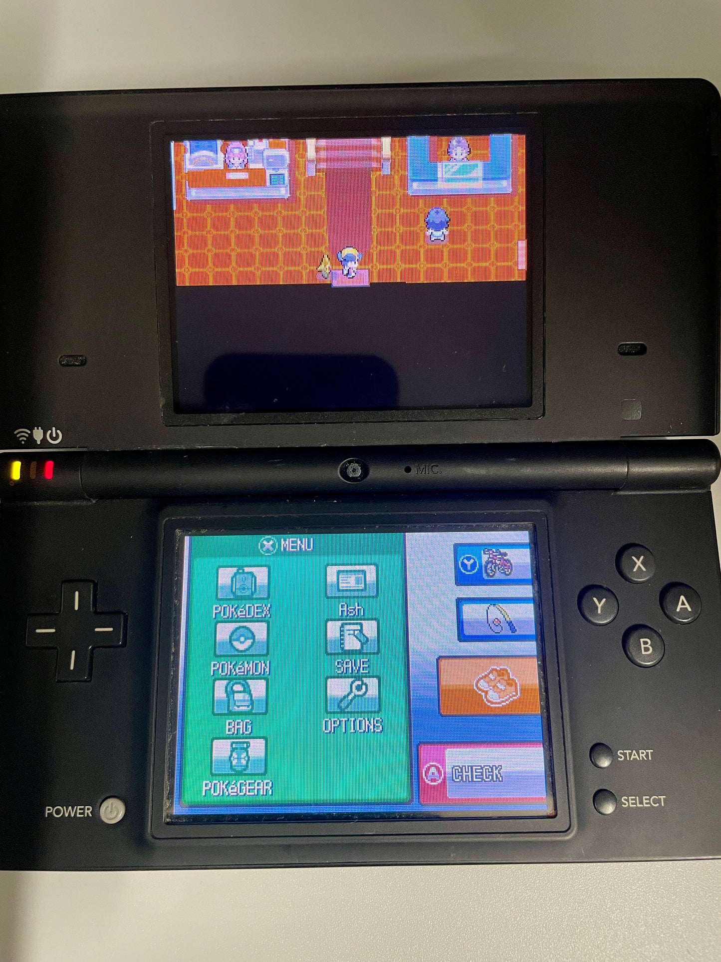 Nintendo DS gaming console with a game displayed on the screen
